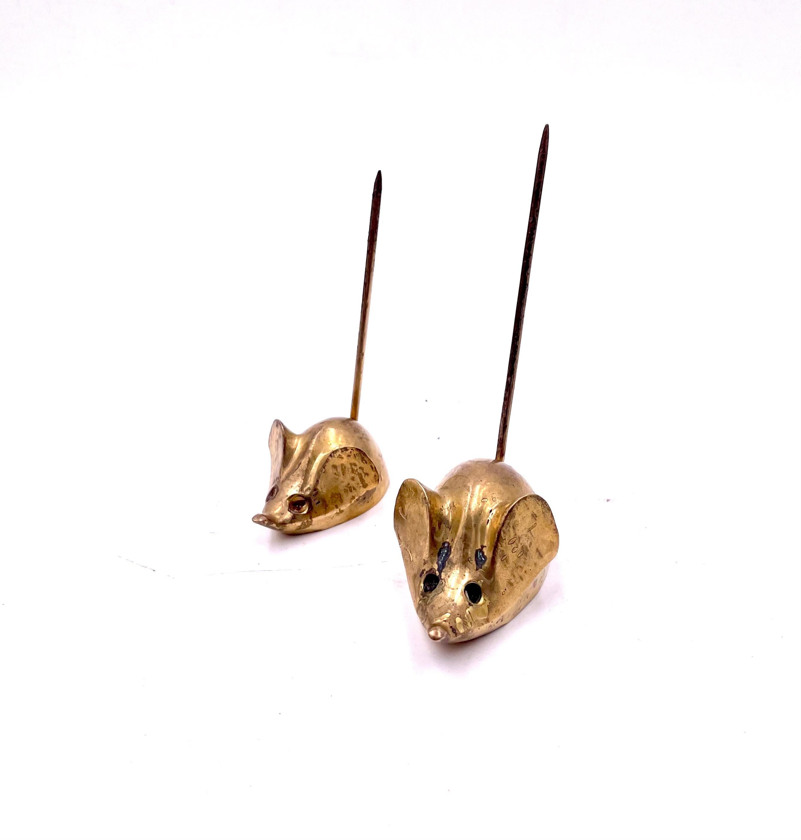 Whimsical pair of patinated brass mouses circa 1970's solid brass that can be polished if desired. the small one is 2