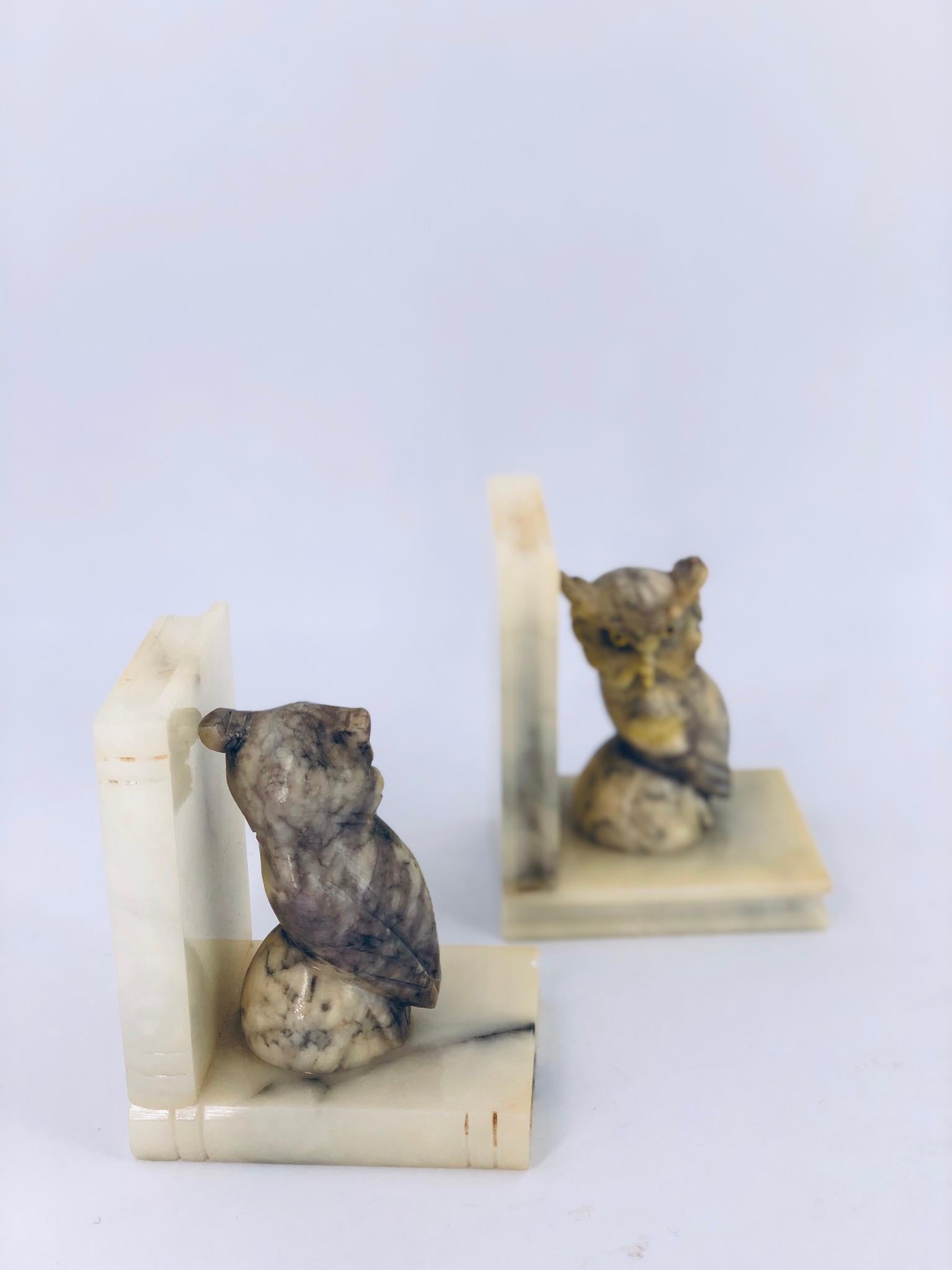 Whimsical pair of collectible bookends in marble very collectible made in Italy, circa 1960s, retains label as shown one of them shows a chip that's been ground on the top corner side, as shown in the picture these are sold in AS/IS condition that's