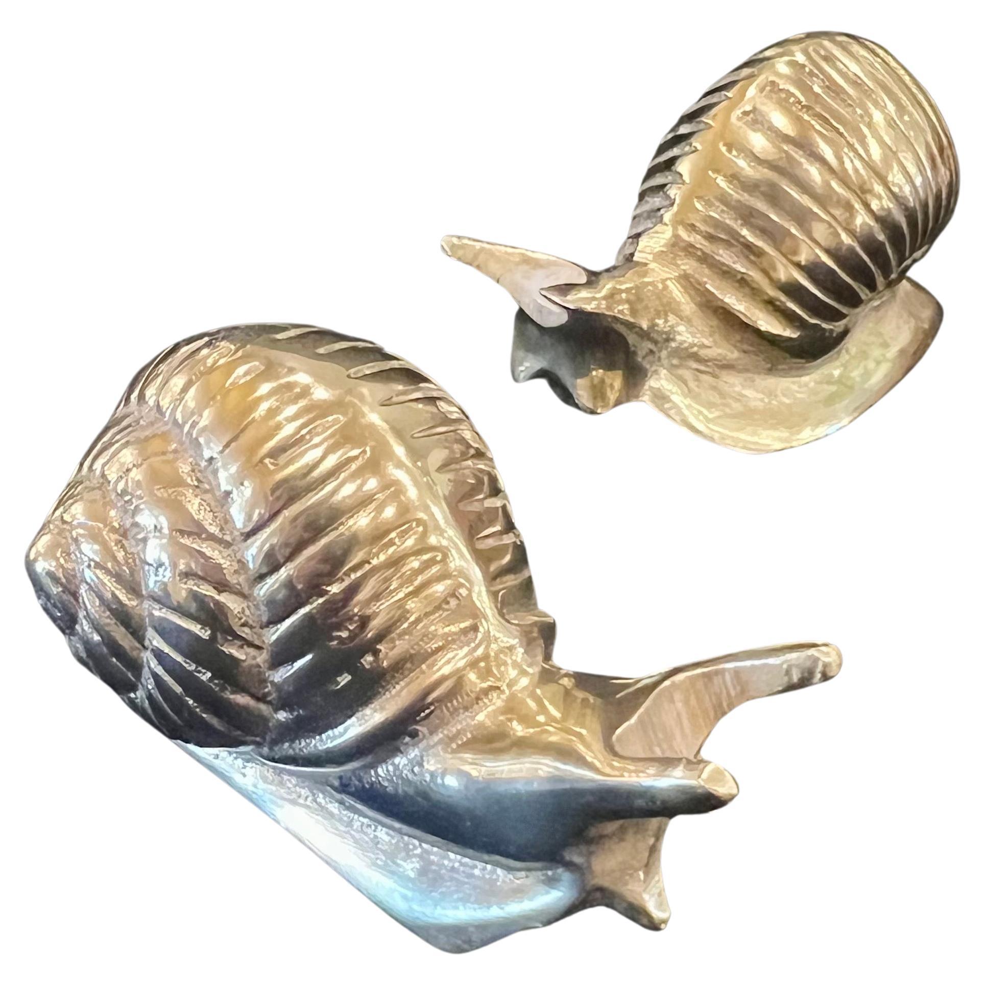 Whimsical pair of solid brass polished snails circa 1980's great for decor or use as paperweights.