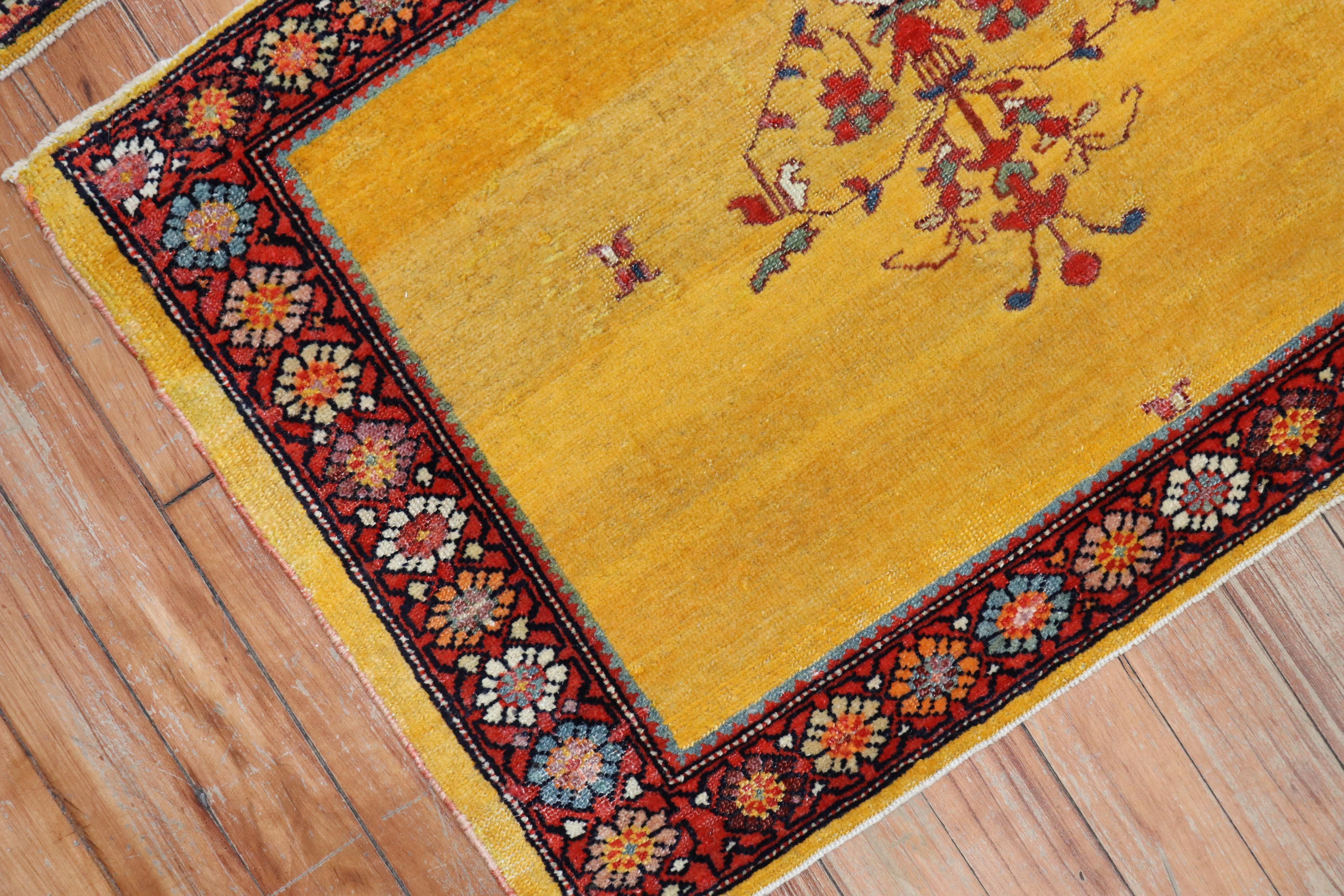 A whimsical pair of one of a kind Persian Ferehan rugs with a bright yellow

Measuring 19