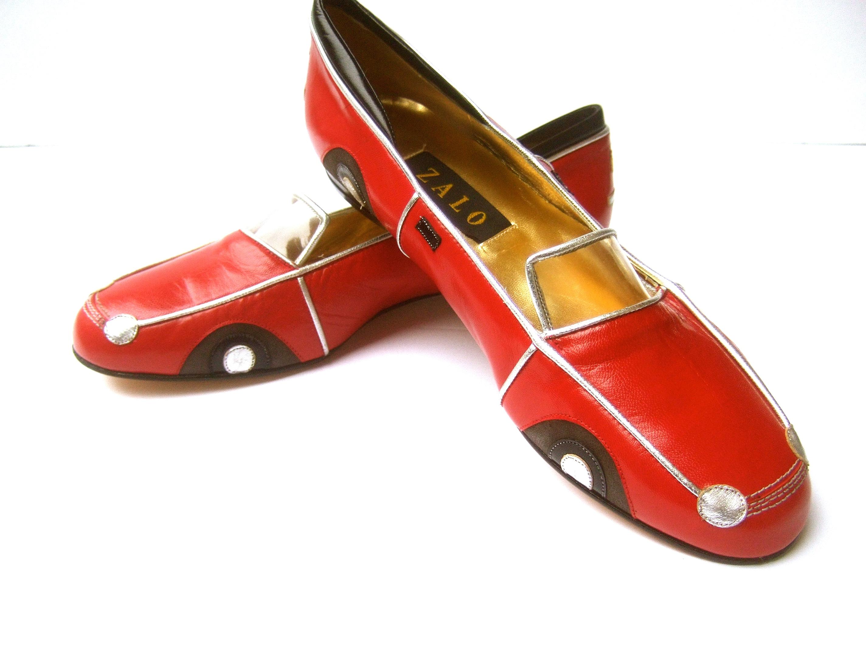 Whimsical red leather sports car design shoes by Zalo US SIze 9 M 
The charming car theme flats are constructed with smooth red leather
Accented with silver leather piping trim; silver headlights and hubcaps 
The windshield is designed with a clear