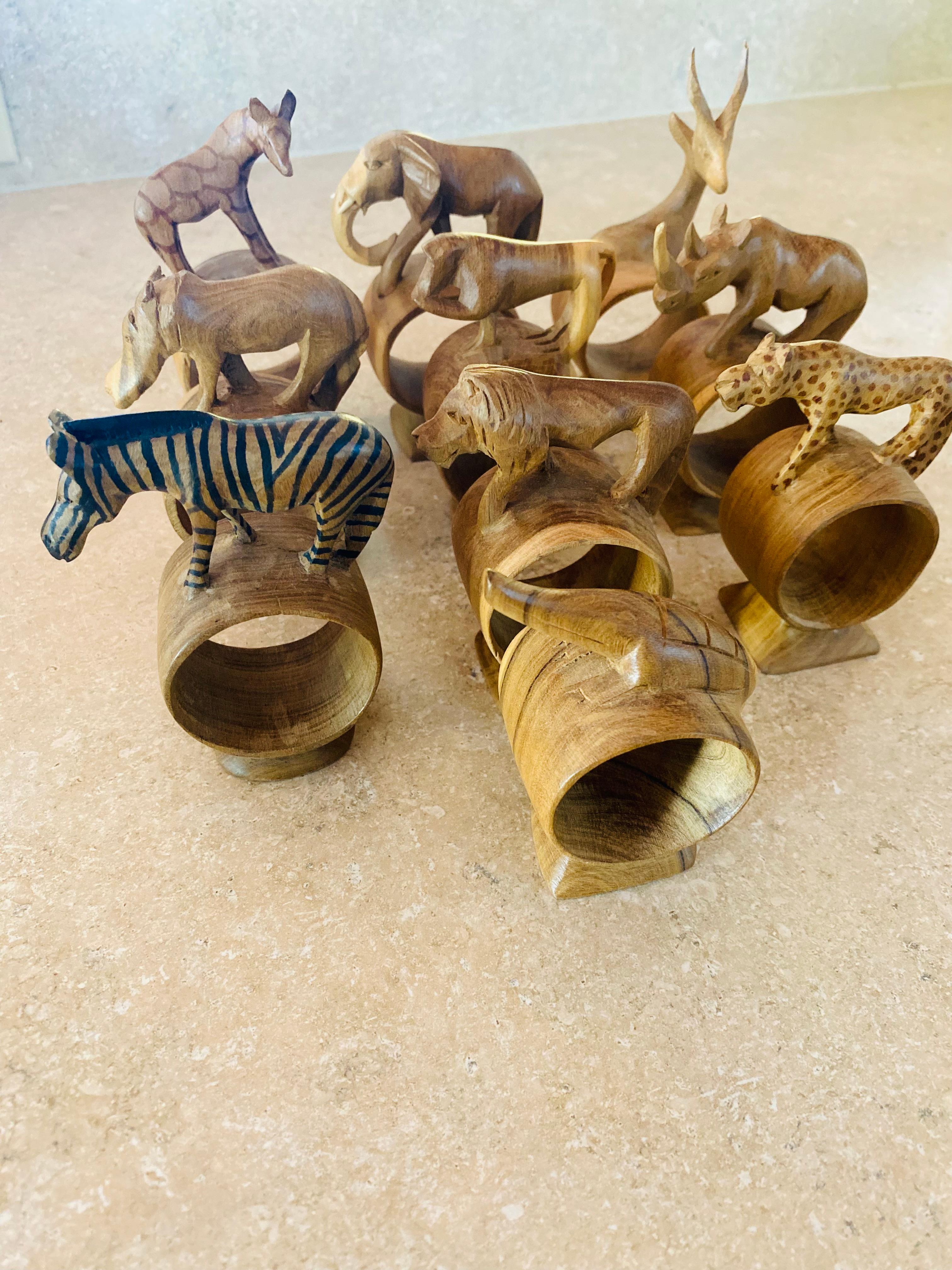 Whimsical Set of 10 Hand Carved African Mix Woods Animals Napkin Ring Holders , circa 1970's walnut , maple etc mahogany.  Incredible pieces of sculpture for your table that will brighten up your special occasions.

Mid-Century, Hollywood Regency,
