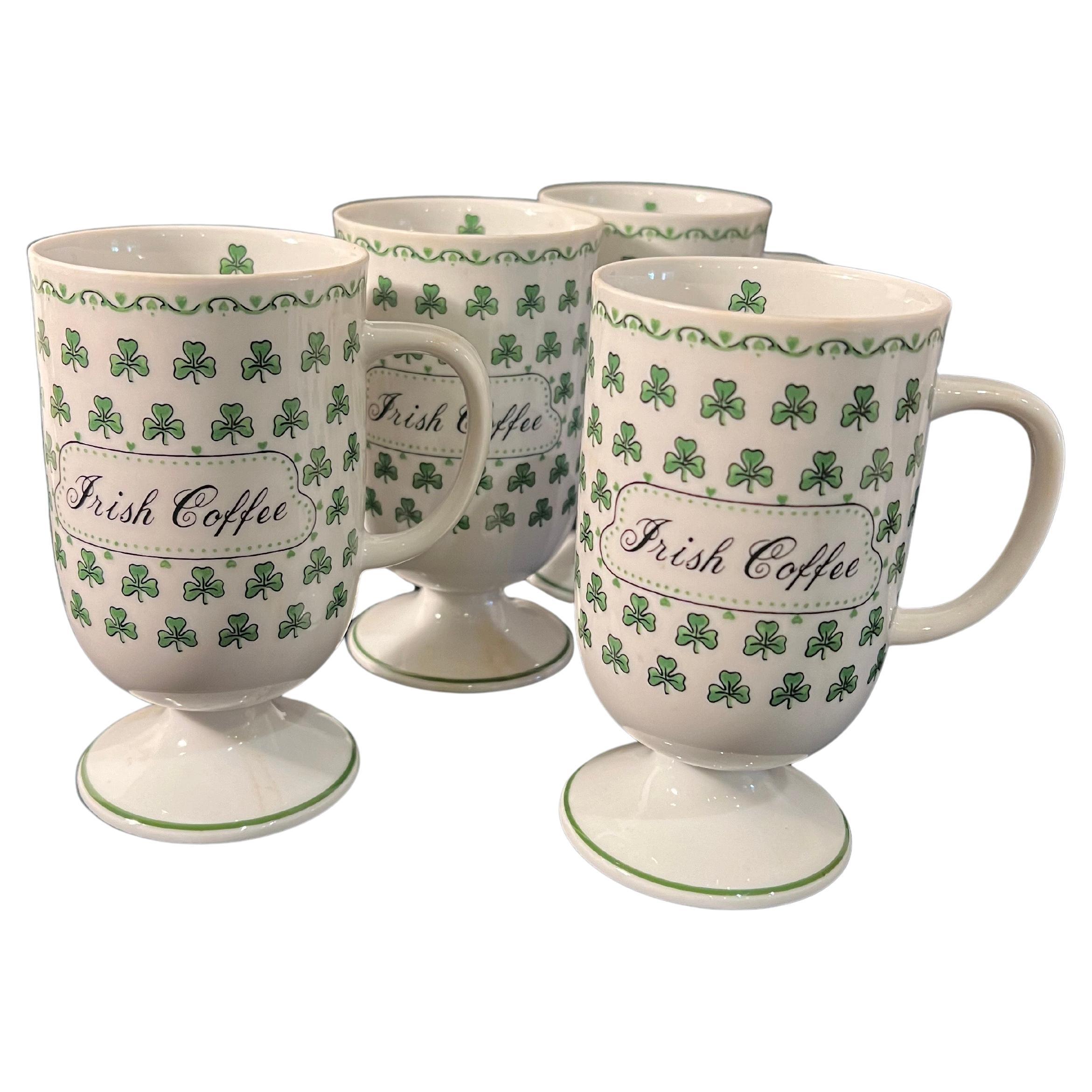 whimsical set of 4 Irish coffee footed mugs with handle excellent condition no chips or cracks , can be used for Espresso , capuccino or regular coffee nice shamrock decor.