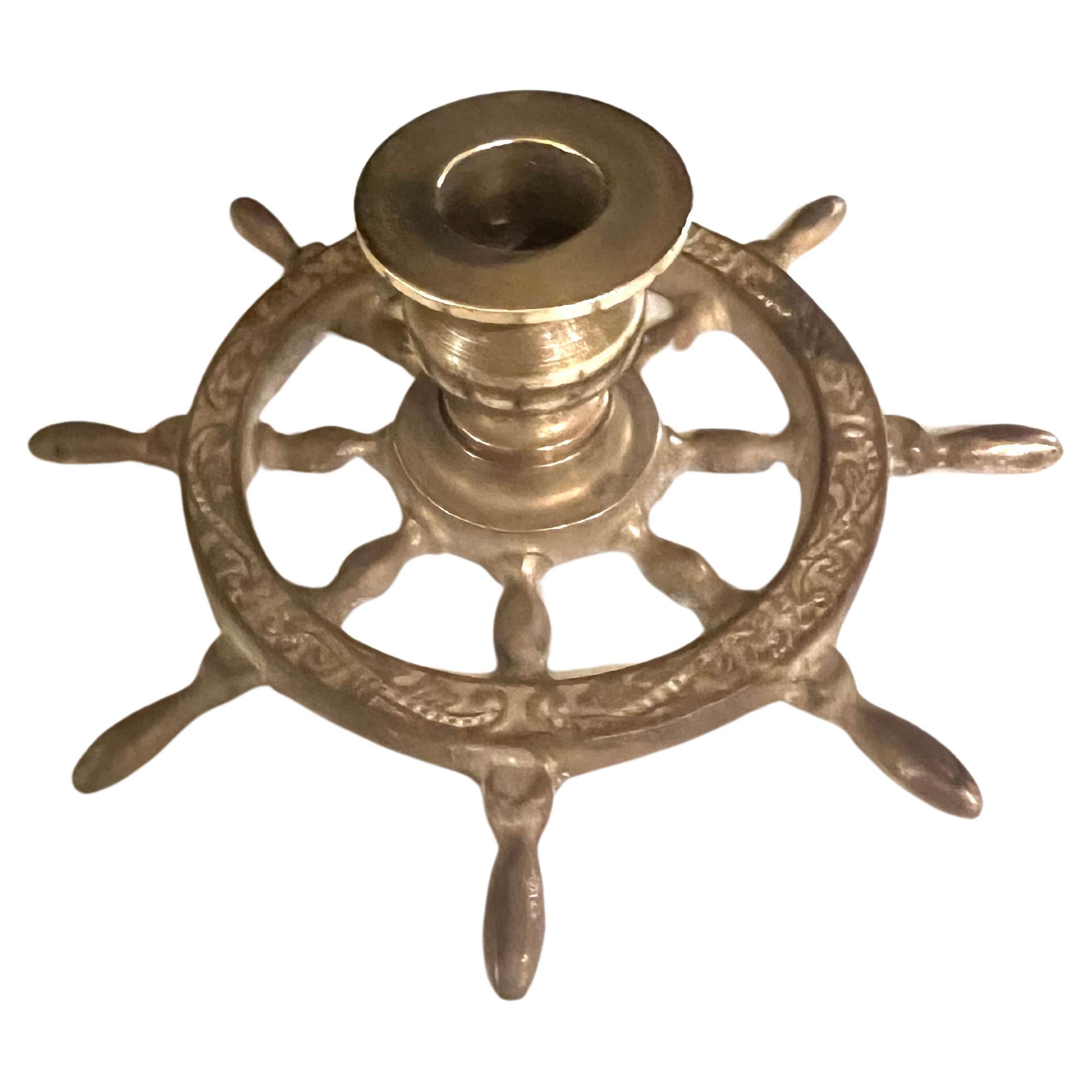 Whimsical pair of solid brass Stering nautical wheels, circa 1970's perfect desktop items the ashtray rotates all solid polished brass with a nice patina.