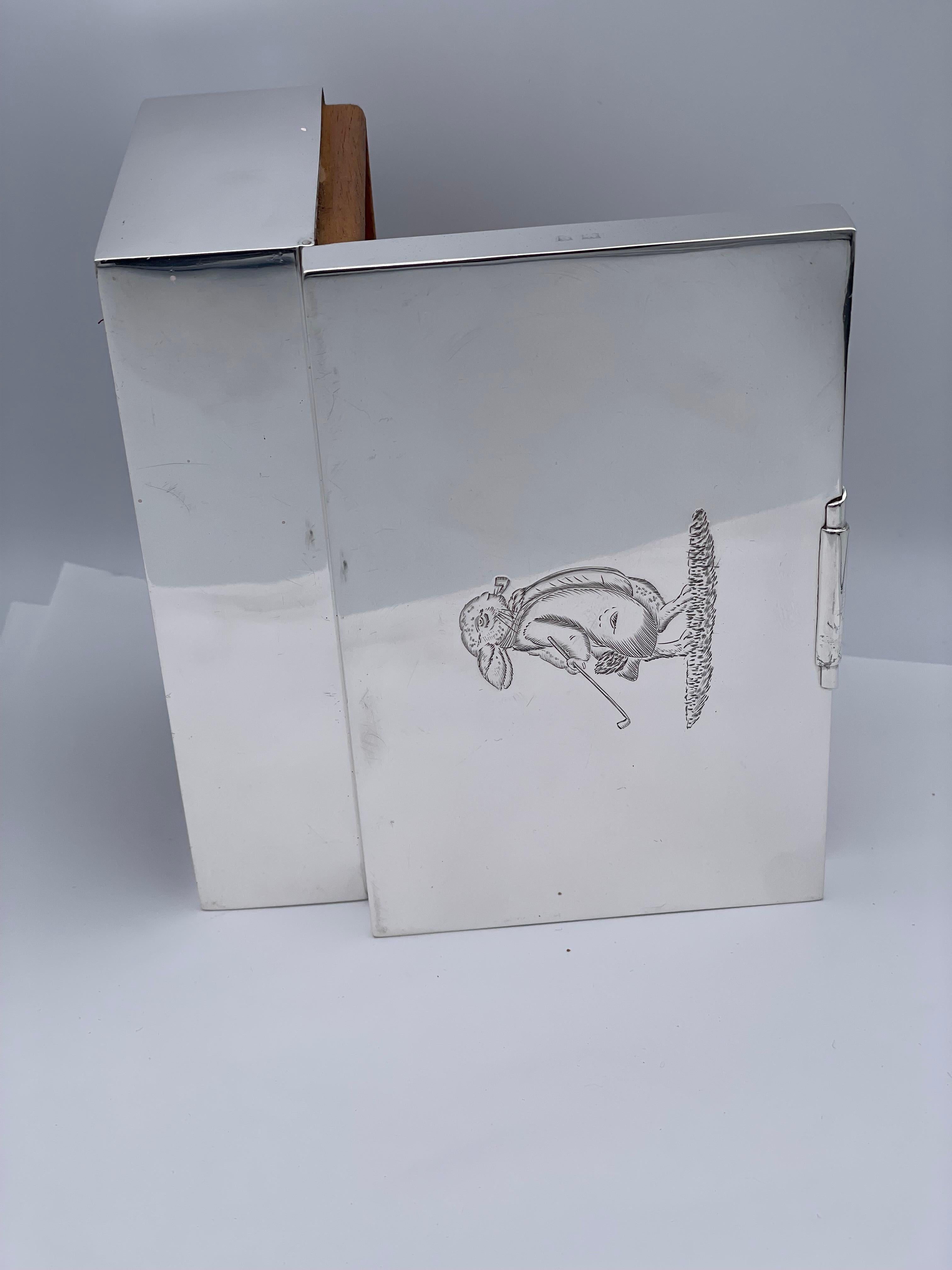 A fabulous one-of-a-kind:  a hinged box with an engraved rabbit, wearing a smoking jacket, holding a golf club and smoking a cigar.  Solid gauge sterling silver.  Made in Birmingham.  3 1/2