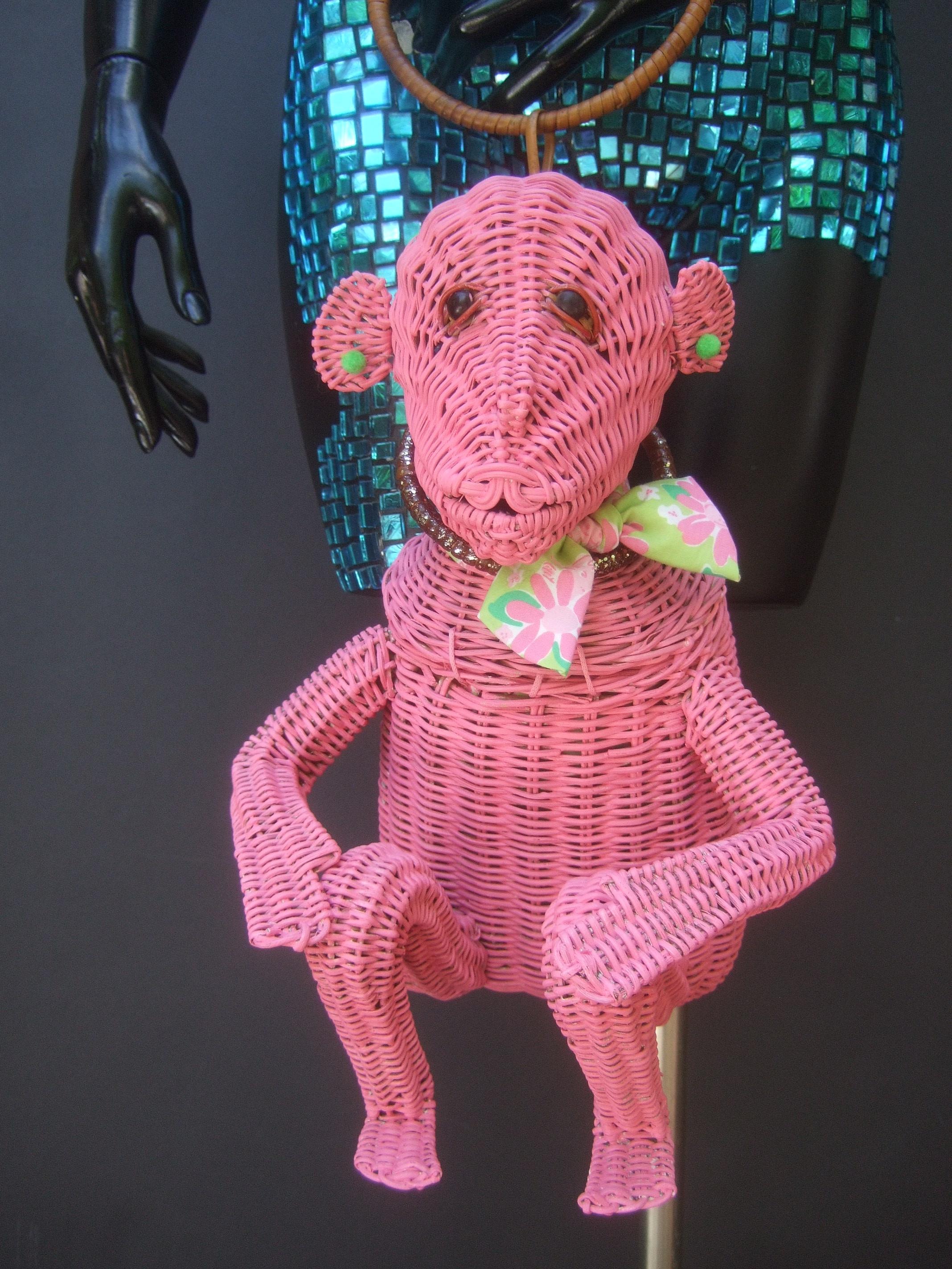 Whimsical vintage handmade artisan wicker monkey handbag with Lilly Pulitzer fabric c 1950s
The charming light weight wicker monkey handbag was originally designed in the 1950s
Has had a 21st century makeover. The original handbag was designed with