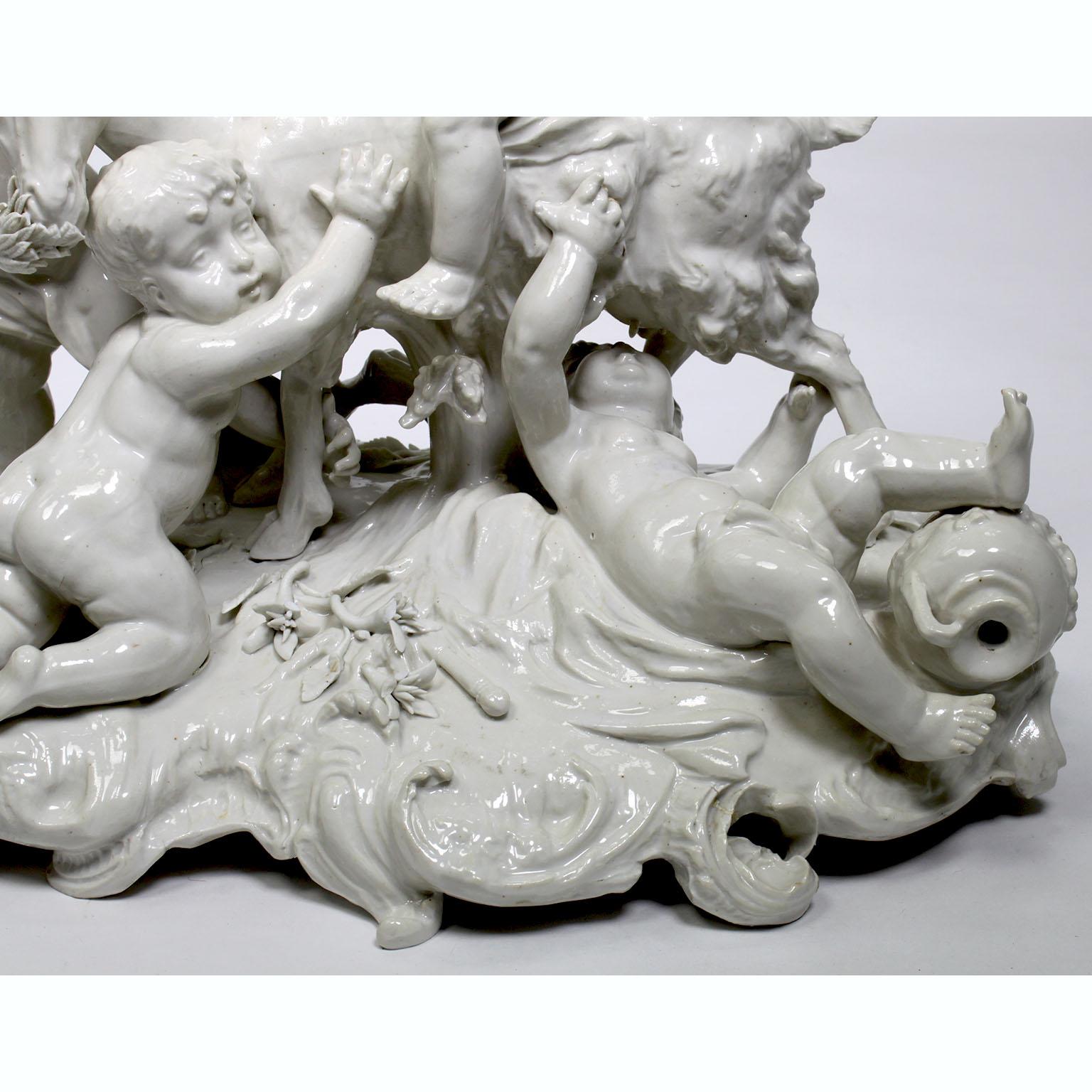 Classical Greek Whimsical White Glazed Porcelain Group of Four Putti Playing with a Goat For Sale