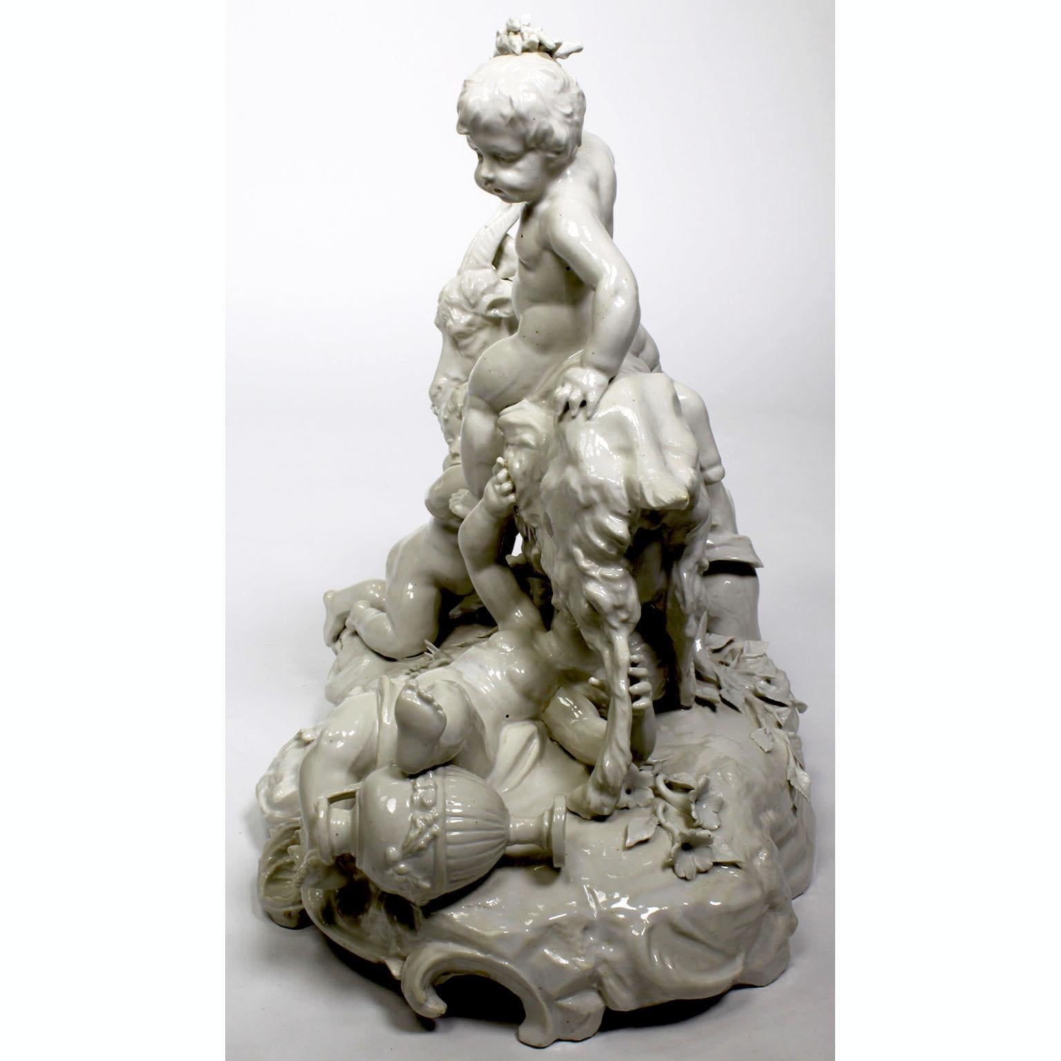 Early 20th Century Whimsical White Glazed Porcelain Group of Four Putti Playing with a Goat For Sale