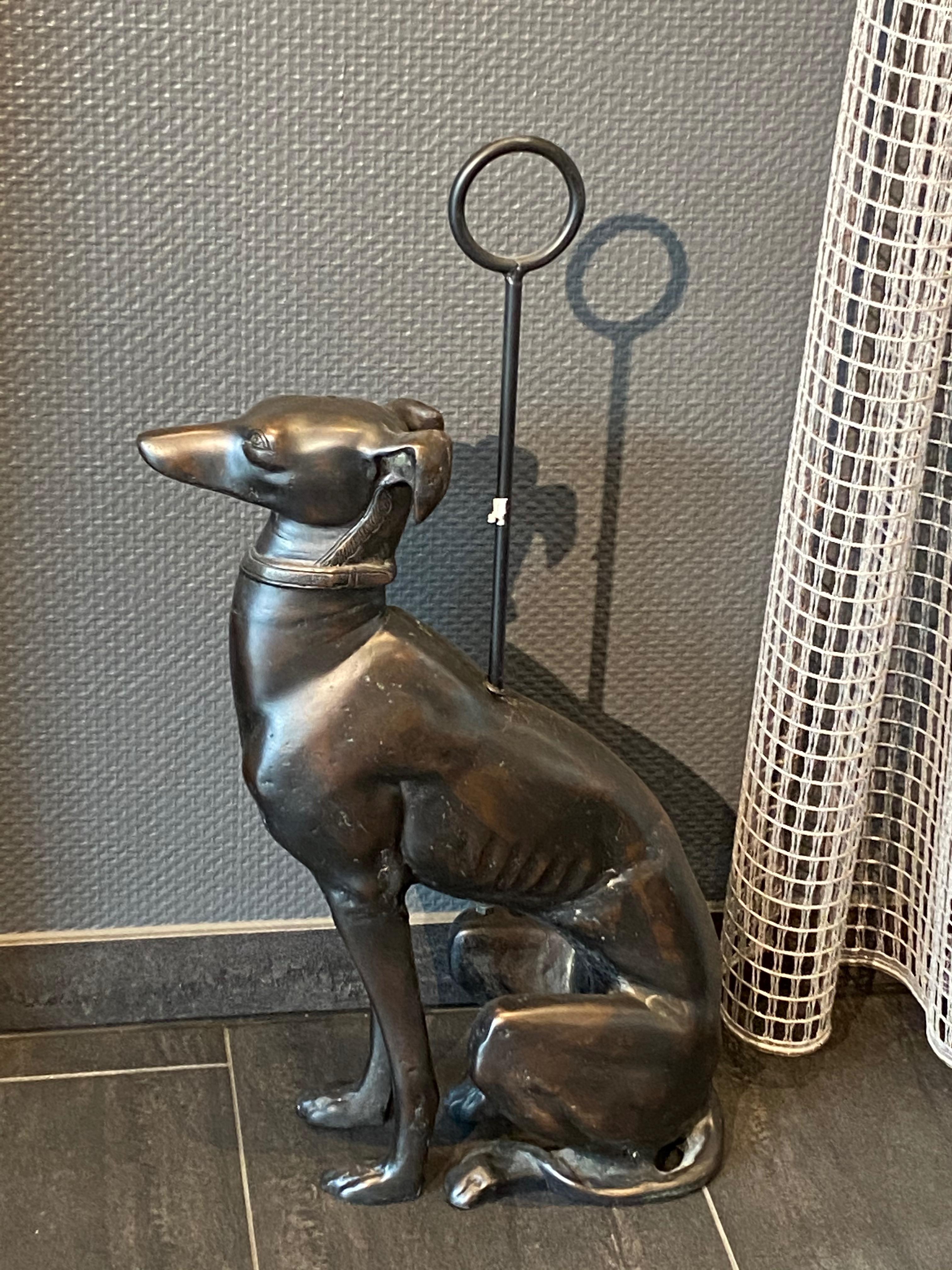 A beautiful and substantial Art Deco style bronze whippet or greyhound dog sculpture door stand measuring totally 28