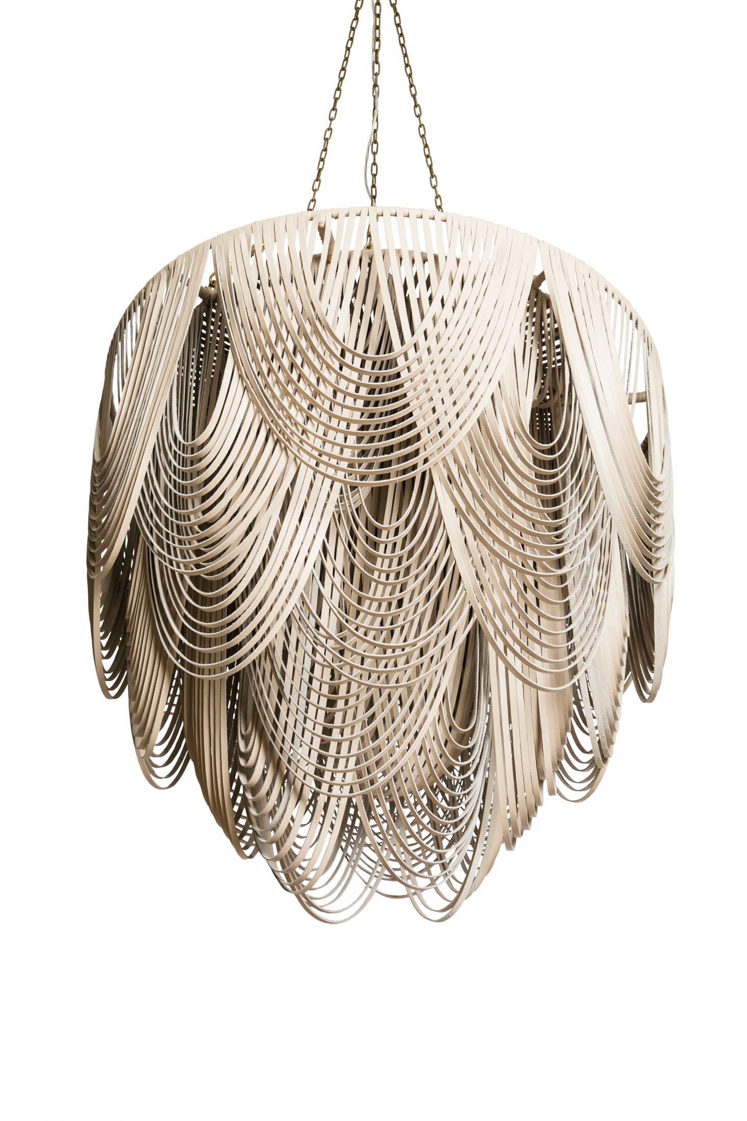 Perhaps the most unexpected textile for a light fixture, the leather Whisper Chandelier is handcrafted with swags of leather layered in graceful arcs for a stunning-yet- natural look. The ambient light from within the fixture provides a soft