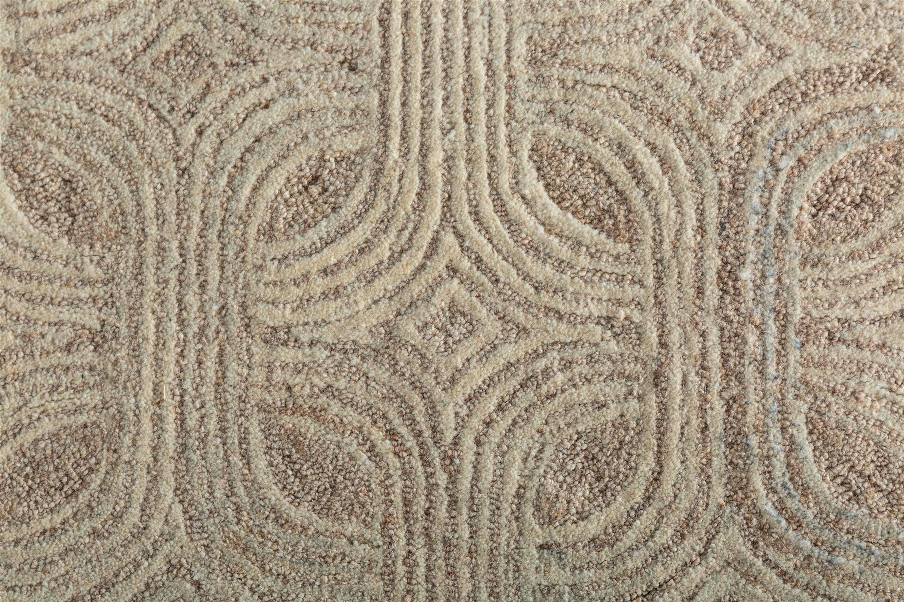 Introducing our modern, hand-tufted rug—a work of art crafted from quality wool, resulting in a dimensional and organic-inspired aesthetic. The  beautiful rug, with its Art Deco-inspired motif, captivates with a structural and intriguing repeat