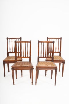 Whispers of the Salon: A Neoclassical Set of Four Turned Side Chairs