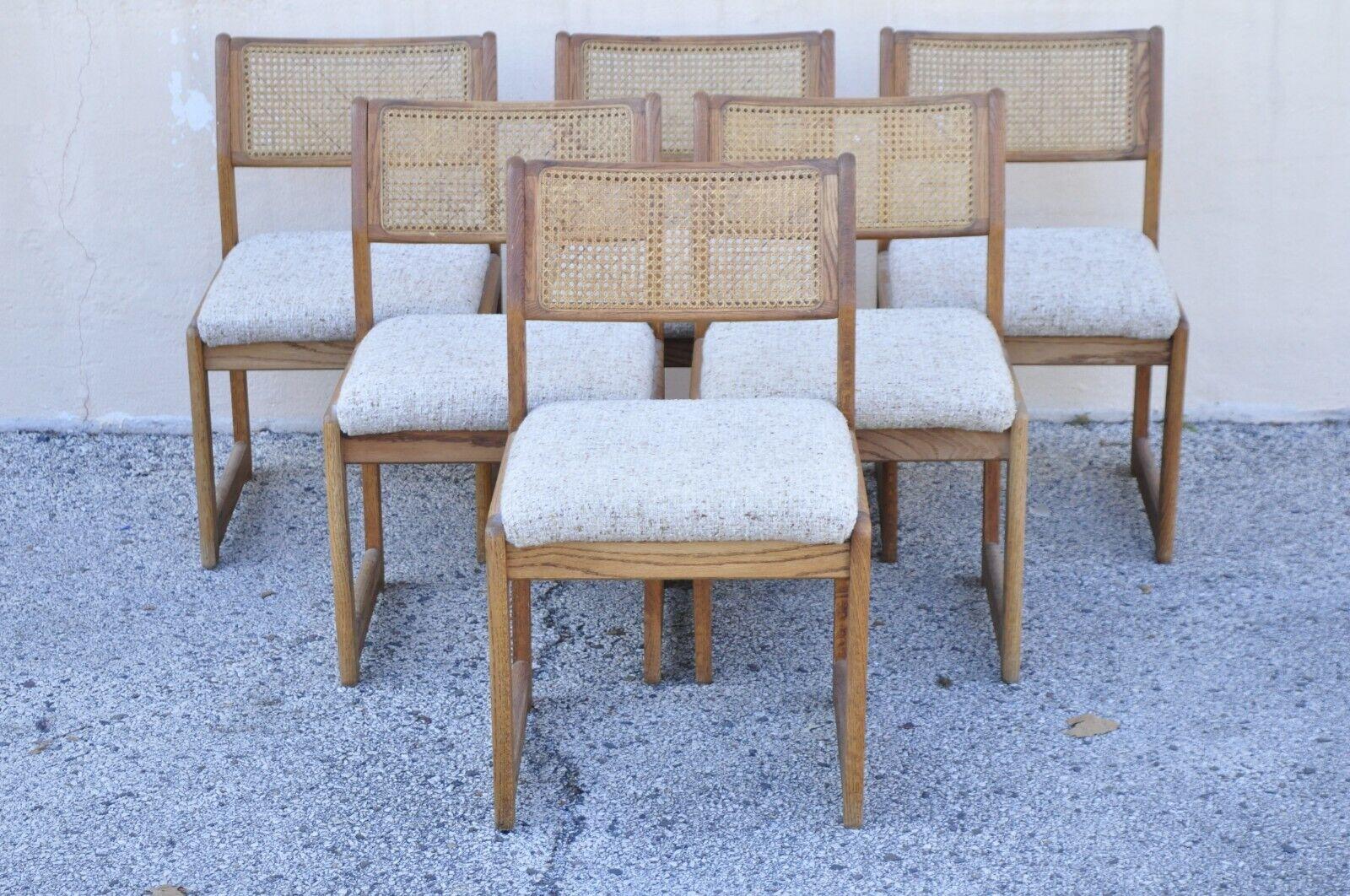 Whitaker Furniture Oak Wood Cane Back Modern Dining Side Chairs - Set of 6. Item features  (6) Side chairs, oak wood frames, cane back panels, oatmeal colored Nubby wool upholstery. Circa Late 20th Century. Measurements: 32