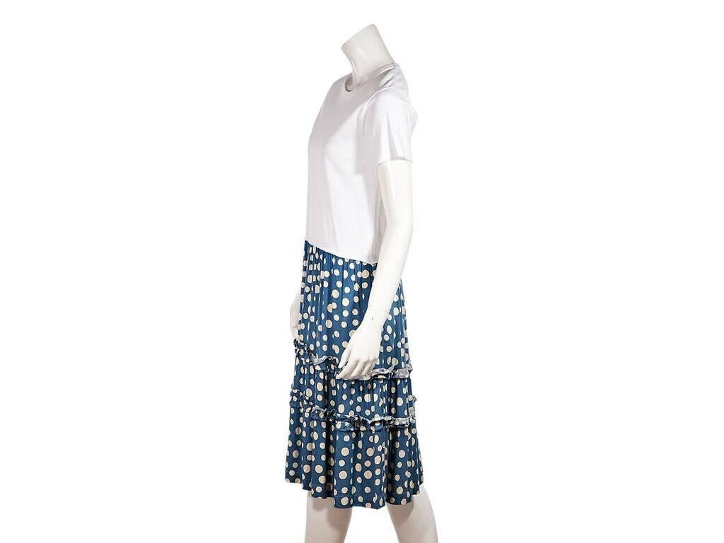 Product details:  White and blue polka-dot dress by Comme des Garcons Girl.  Twofer design gives the illusion of separates.  Crewneck.  Short sleeves.  Ruffles trim skirting.  Pullover style.  36