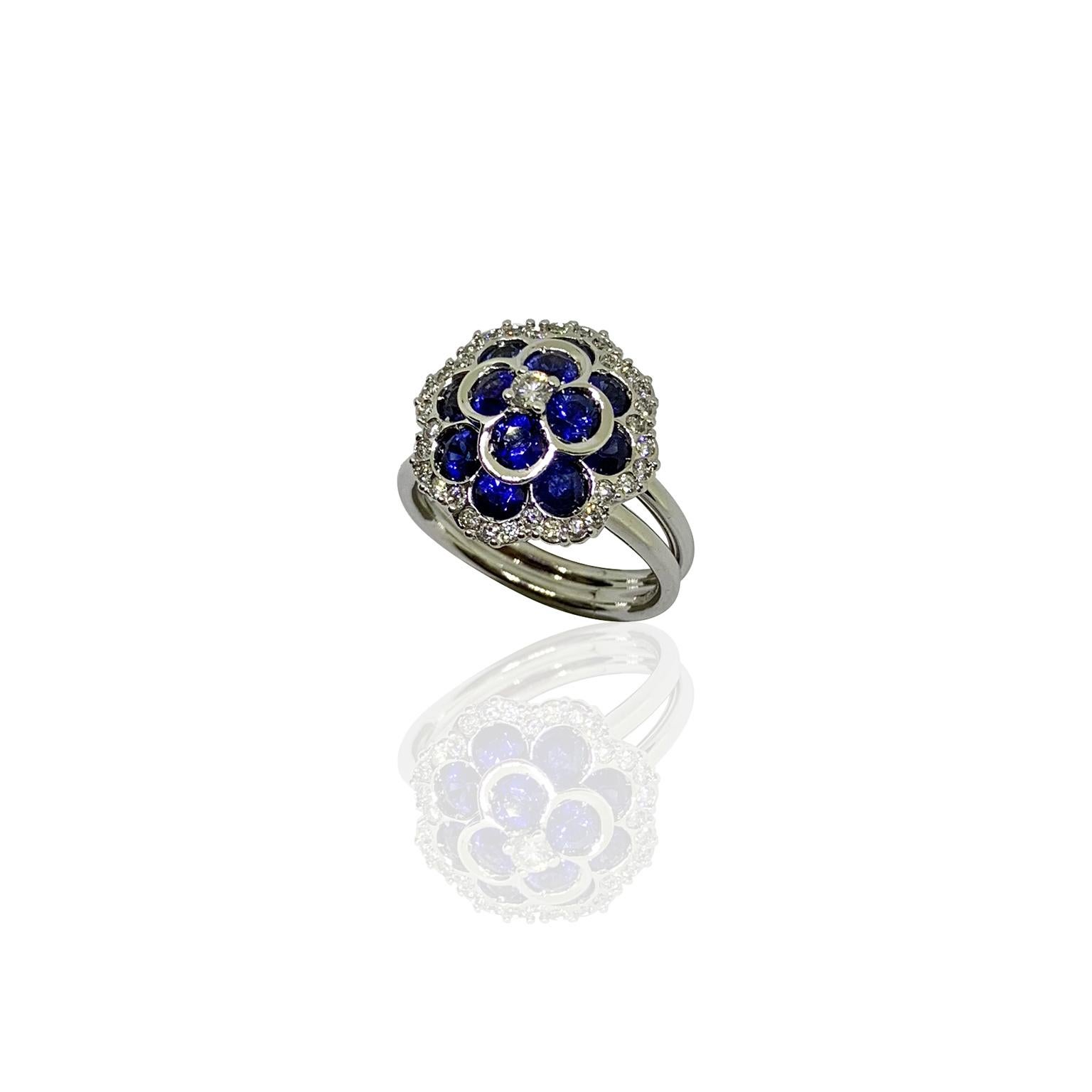 White 18 kt gold ring diamonds and natural blu sapphire designing a flour
Stamp 750
total gold weight. g 10,00
total diamond weight ct 0,50
total sapphire weight 2,23
usa size 7 1/2