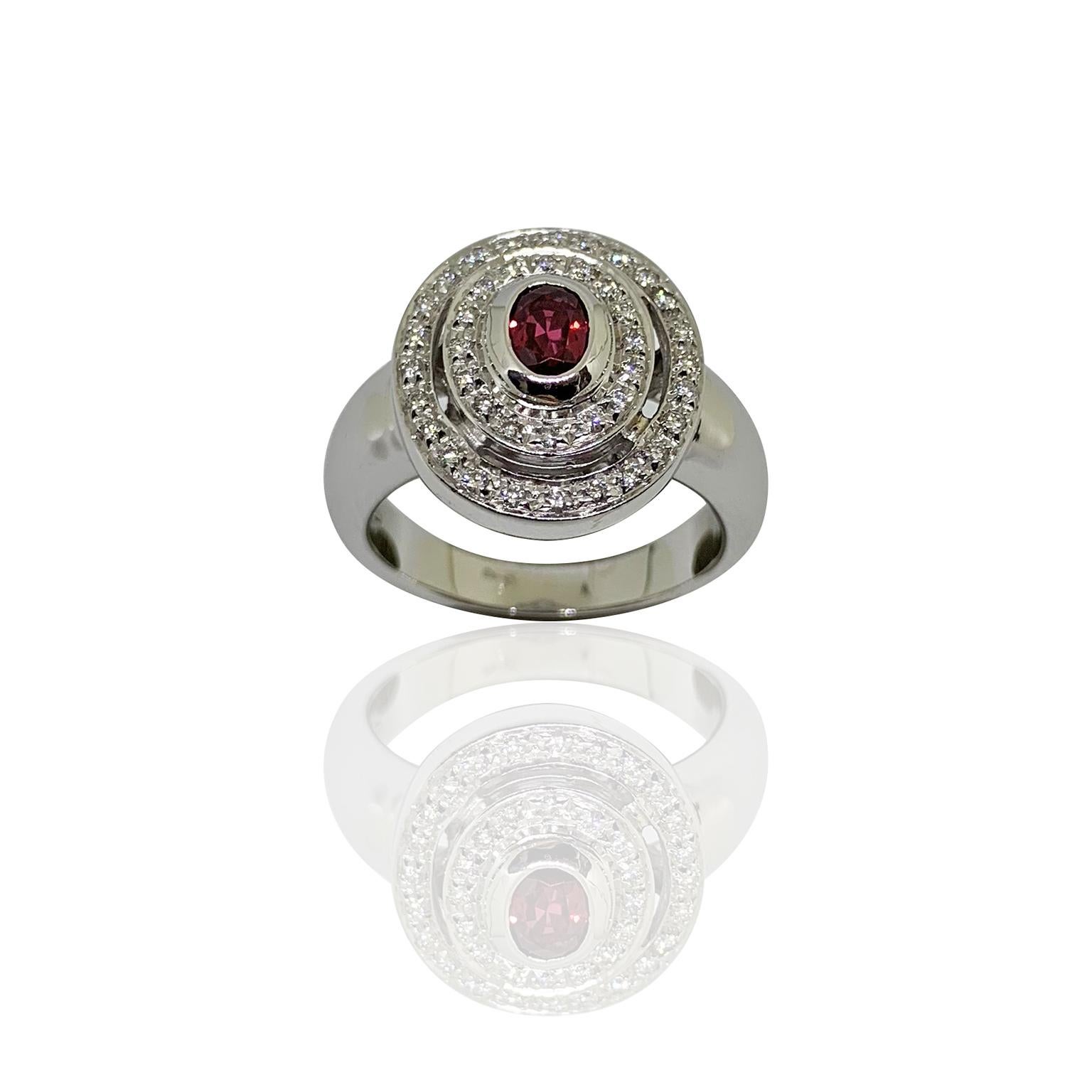 White 18 kt gold ring diamonds and natural ruby round design
Stamp 750
total gold weight 11,50
total diamond weight 0,24
total ruby weight 0,45
usa size 7 1/2