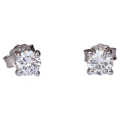 White 18 kt gold solitair stud earrings with diamonds 0.74 crt