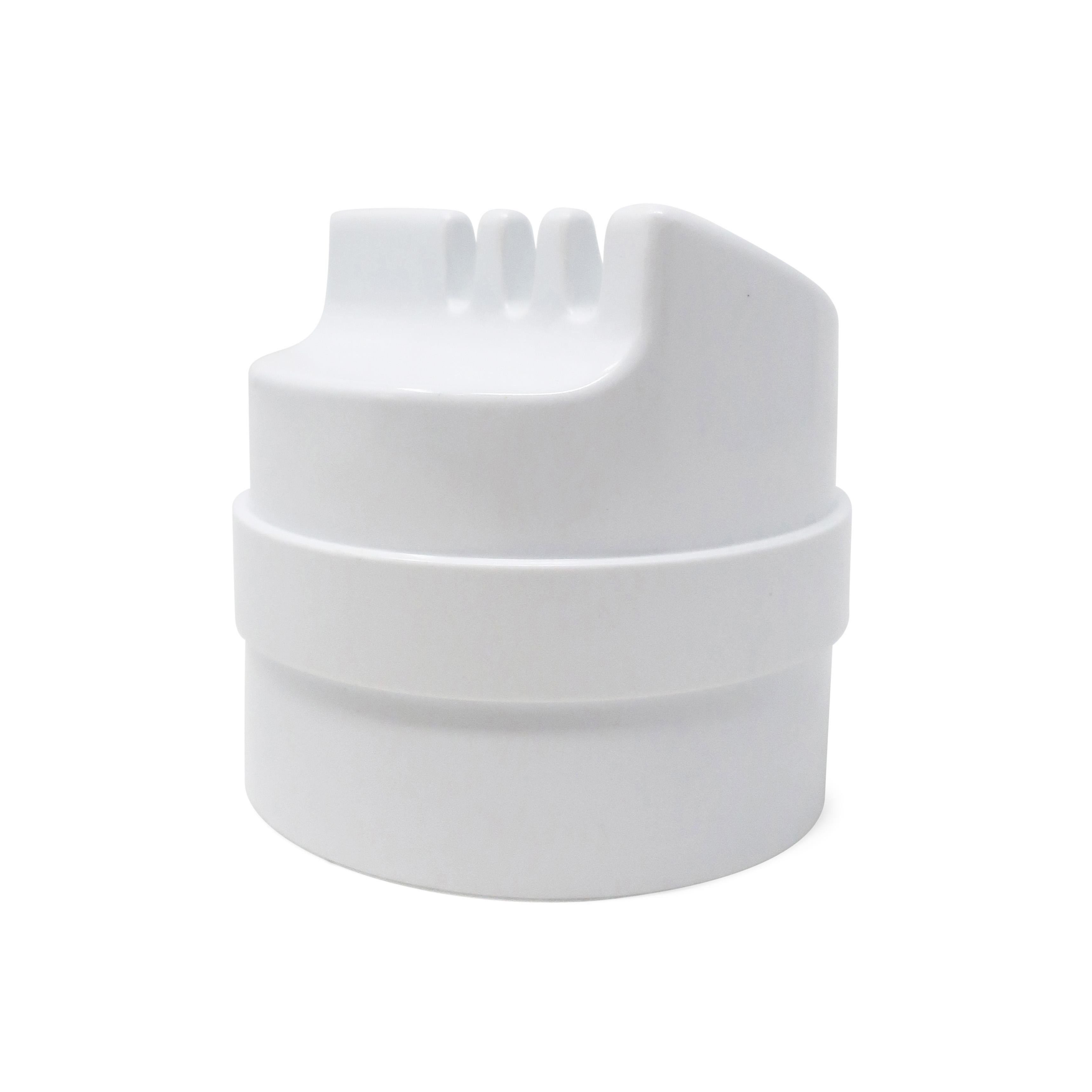Originally designed in 1970 and produced by Kartell in 1973 two years after designer Joe Colombo's death, the Kartell 4630 Roto/Rotocenere ashtray is Colombo at his finest. White plastic construction with beautiful lines and a thoughtful design that