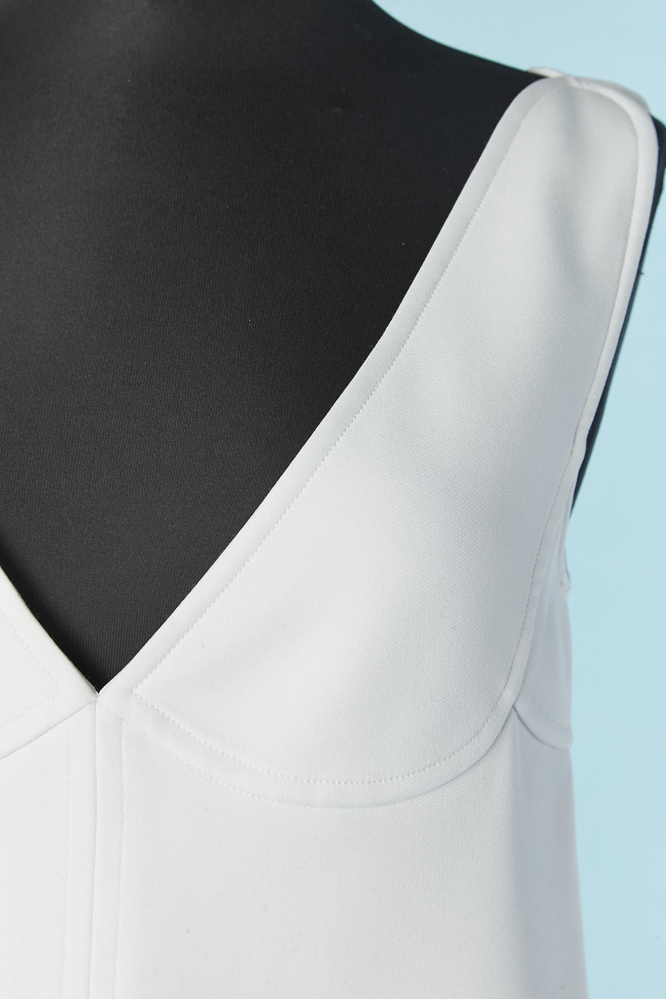 White A Line sleeveless dress with cut-work. Fabric composition and lining: 100% polyester. Pocket on both side. Zip and hook&eye closure on the middle back. 
SIZE 40 / M 