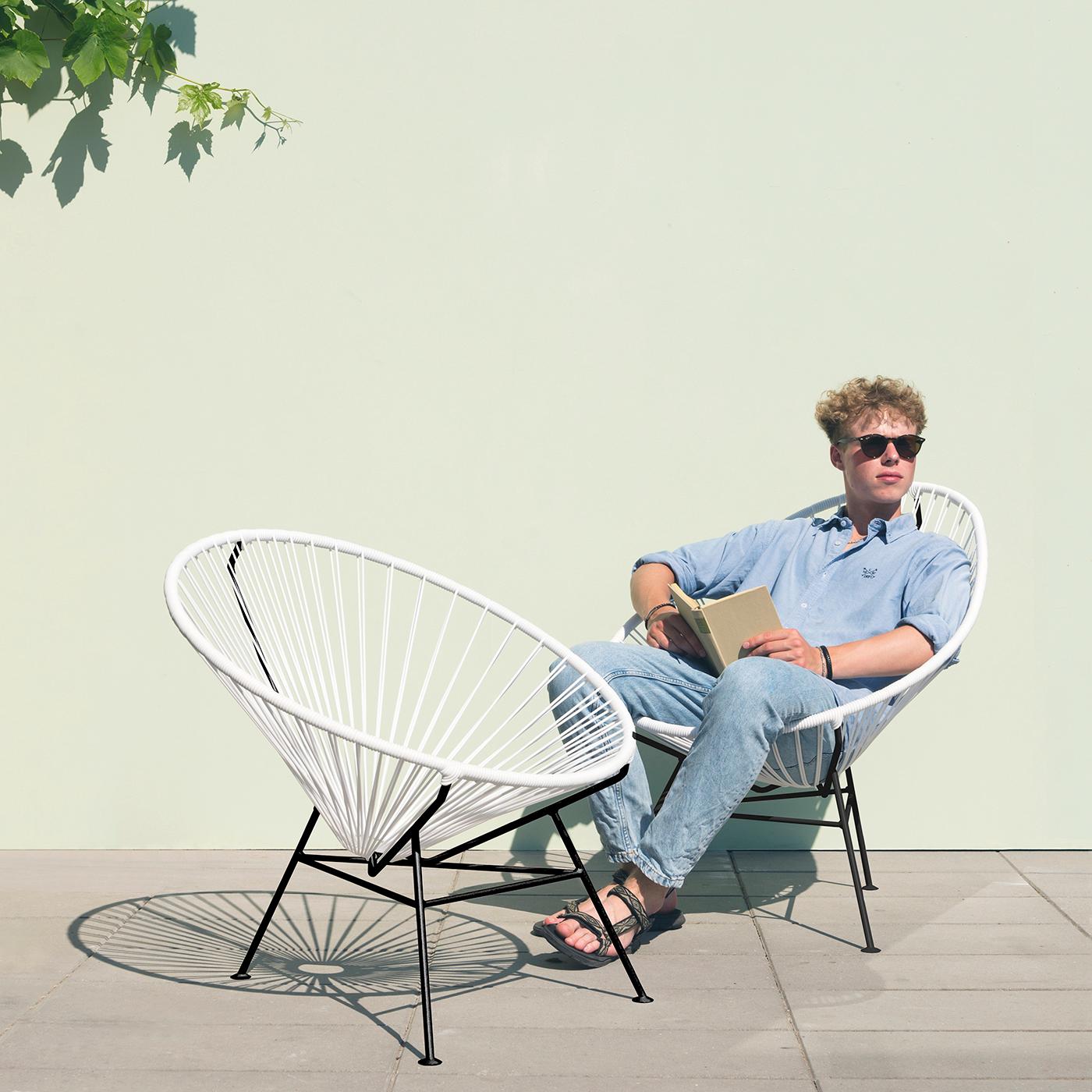 White Acapulco Chair by OK Design
Dimensions: D 110 x W 79 x H 72 cm.
Materials: Powder-coated metal, PVC cord.

Available with black frame, white frame, or stainless steel frame.
Available in other colors. Please contact us.

The Original Acapulco