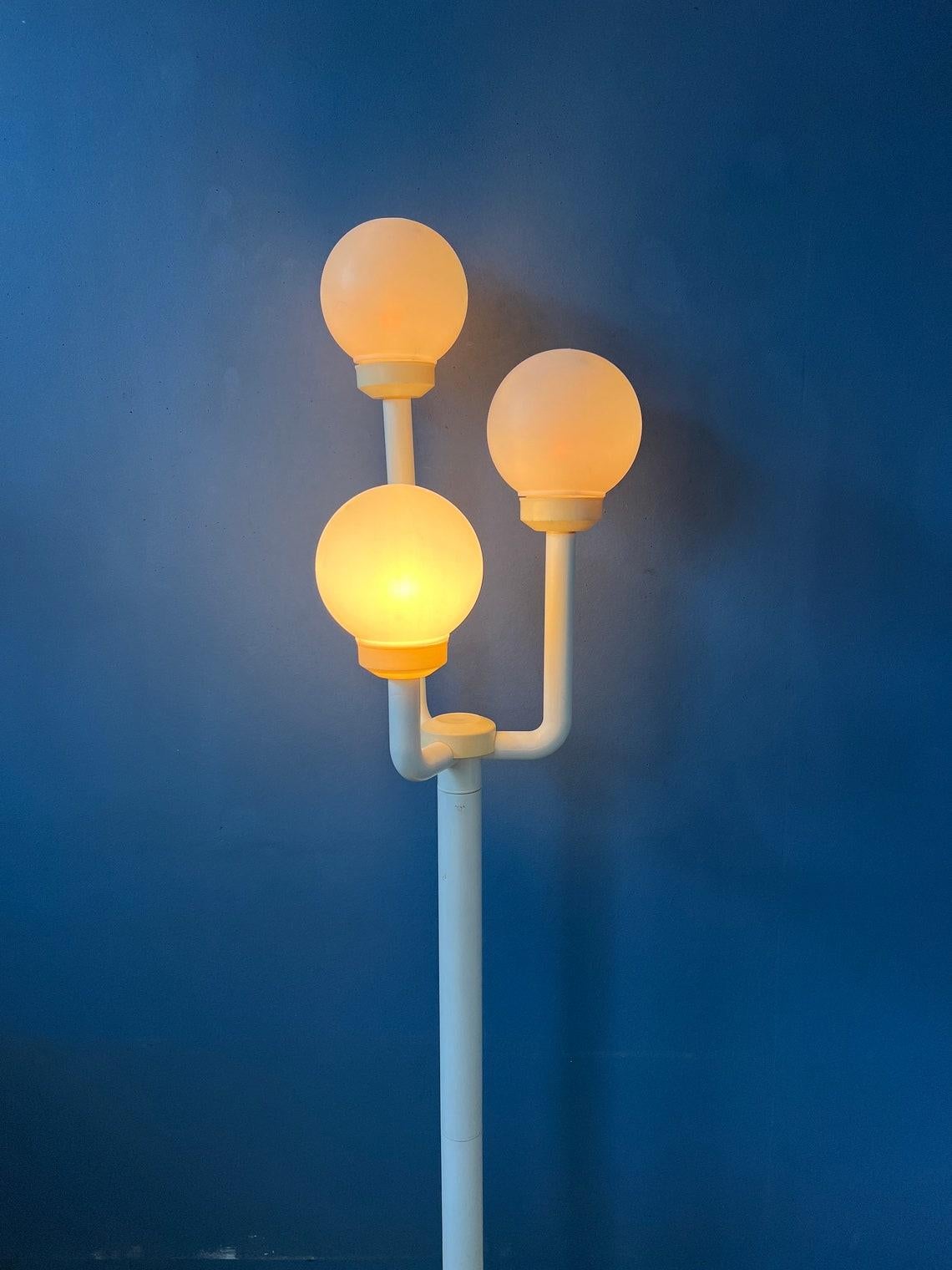 Very rare space age floor lamp made with three arms carrying eyeball shades. The lamp is made entirely out of plastic, it is therefore very light. The lamp requires three E26/27 lightbulbs and currently has an EU-plug (easily used outside EU with
