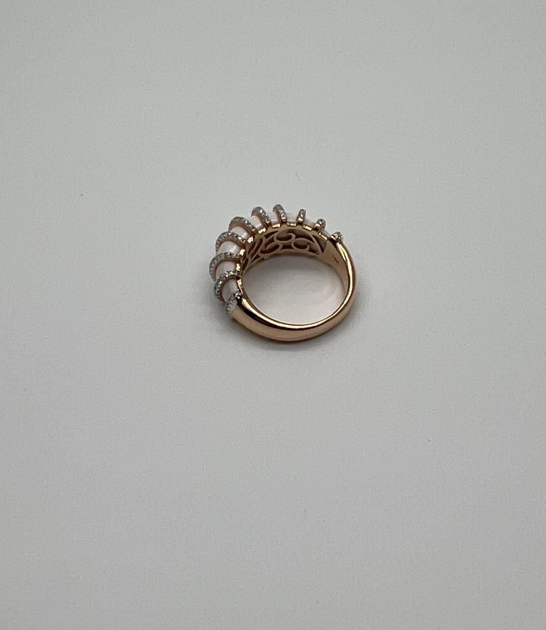 Set with Vertical Cabochon White Agate. Accented by Rows of Sparkling Diamonds G/VS Quality. 18 Karat Rose Gold Band.