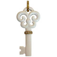 White Agate Fluer De Lis Key Pendant w/ 18k 
Diamonds