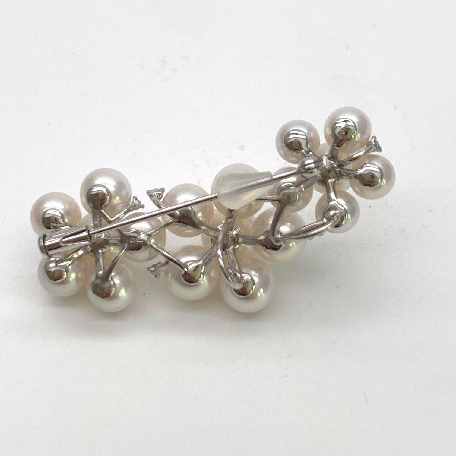 18 White Akoya Pearls Draped Together with an 18K White Gold and Diamond Brooch Pin. A Versatile Design that Can Be Worn in Many Ways. Fashionable and Stylish. Perfect for any Occasion.

Akoya Pearls from Ise Shima Japan are 100% sustainably