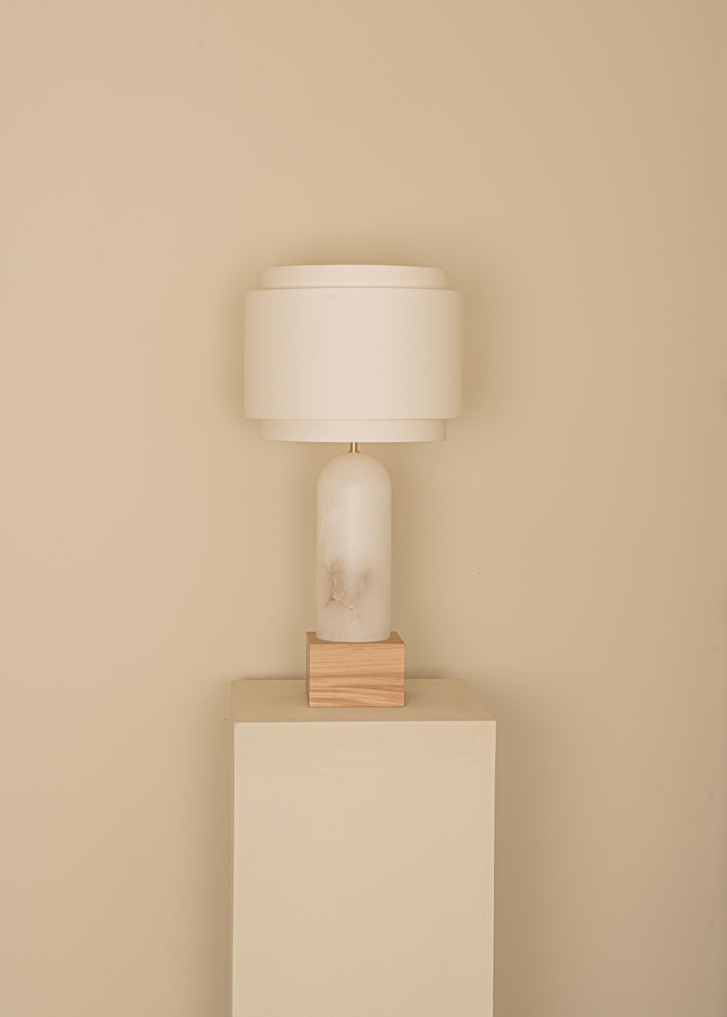 White Alabaster And Oak Base Pura Kelo Double Table Lamp by Simone & Marcel
Dimensions: D 35 x W 35 x H 69 cm.
Materials: Brass, cotton, oak and white alabaster.

Also available in different marble, wood and alabaster options and finishes. Custom