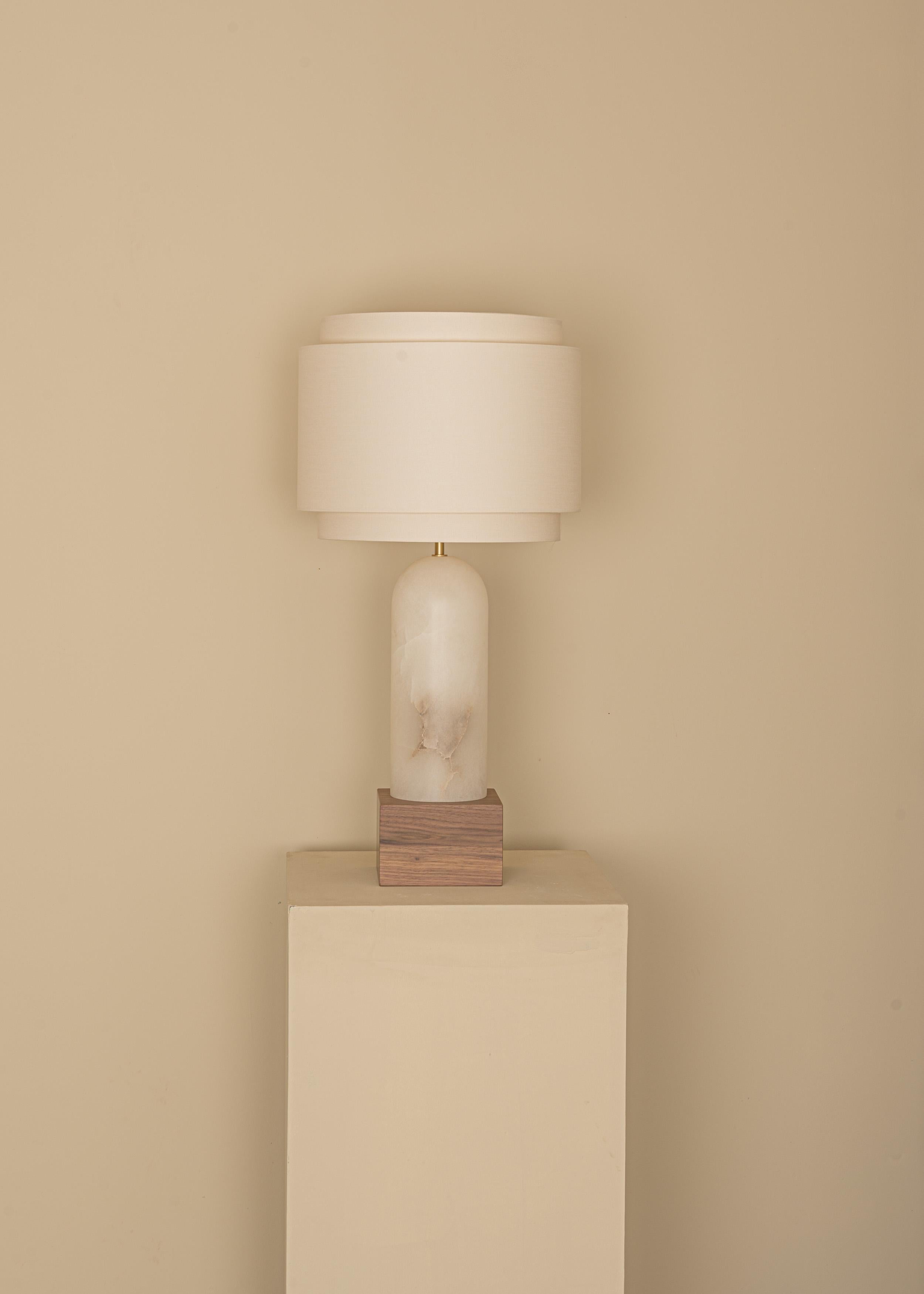 White Alabaster And Walnut Base Pura Kelo Double Table Lamp by Simone & Marcel
Dimensions: D 35 x W 35 x H 69 cm.
Materials: Brass, cotton, walnut and white alabaster.

Also available in different marble, wood and alabaster options and finishes.