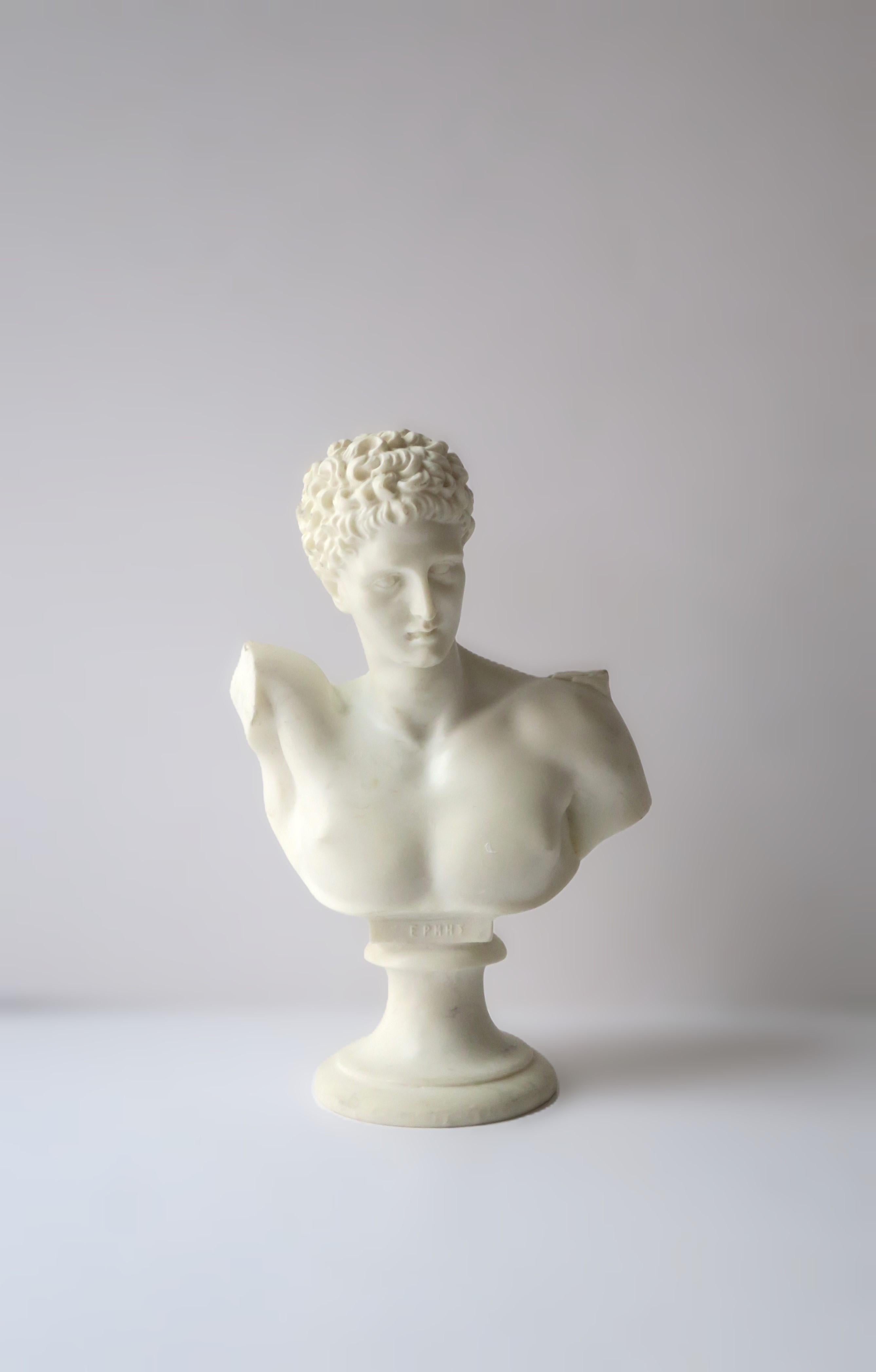 A white alabaster marble bust of ancient Greek god, Hermes. A great decorative object depicting the original sculpture. Piece may work well on a column stand, shelf, bookshelf, library, office, cocktail table, etc. Piece is hand crafted. Dimensions: