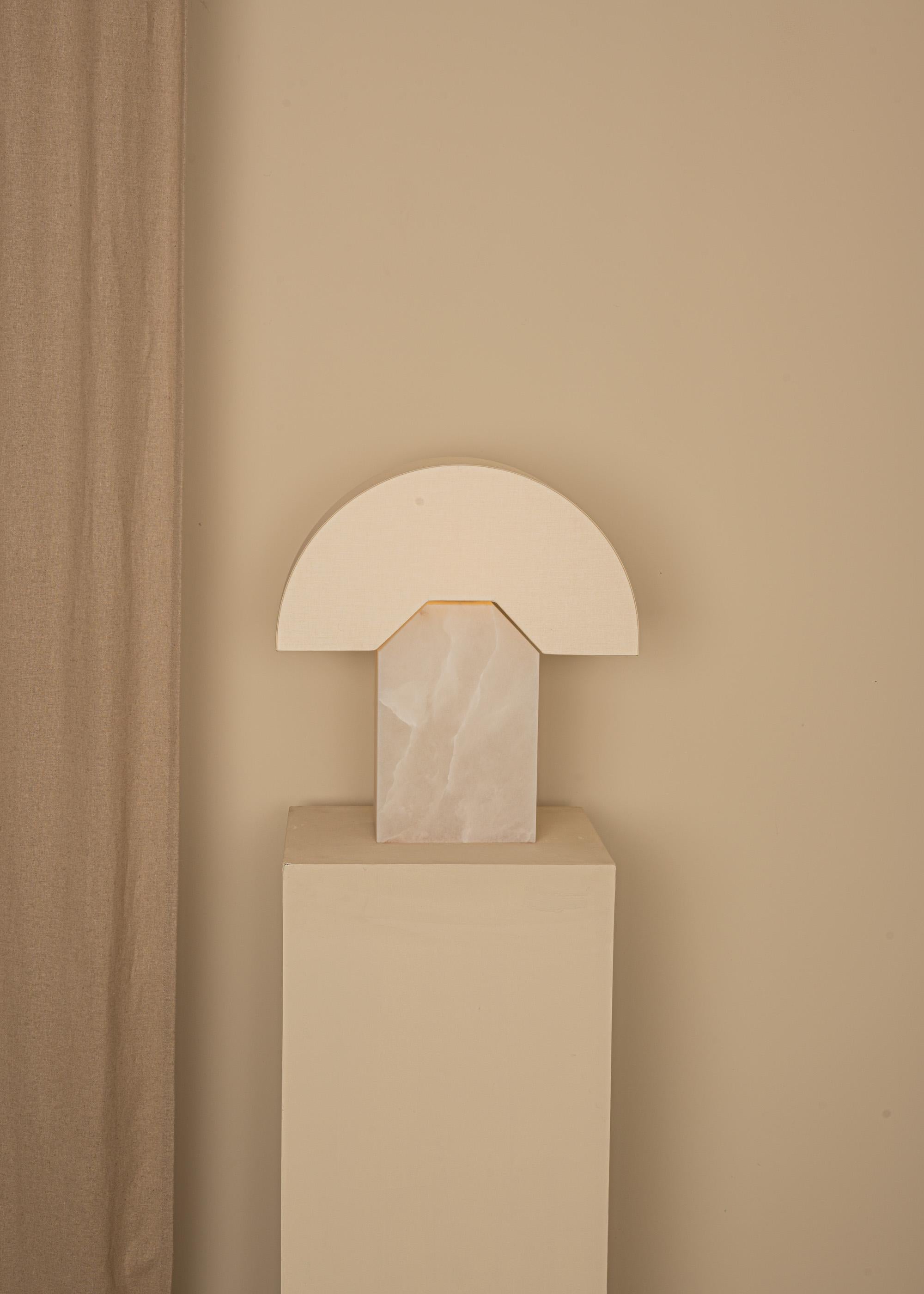White Alabaster Edna Table Lamp by Simone & MarcelMarcel
Dimensions: D 15 x W 44 x H 46 cm.
Materials: Cotton, brass and white alabaster.

Also available in different marbles and ceramics. Custom options available on request. Please contact us.