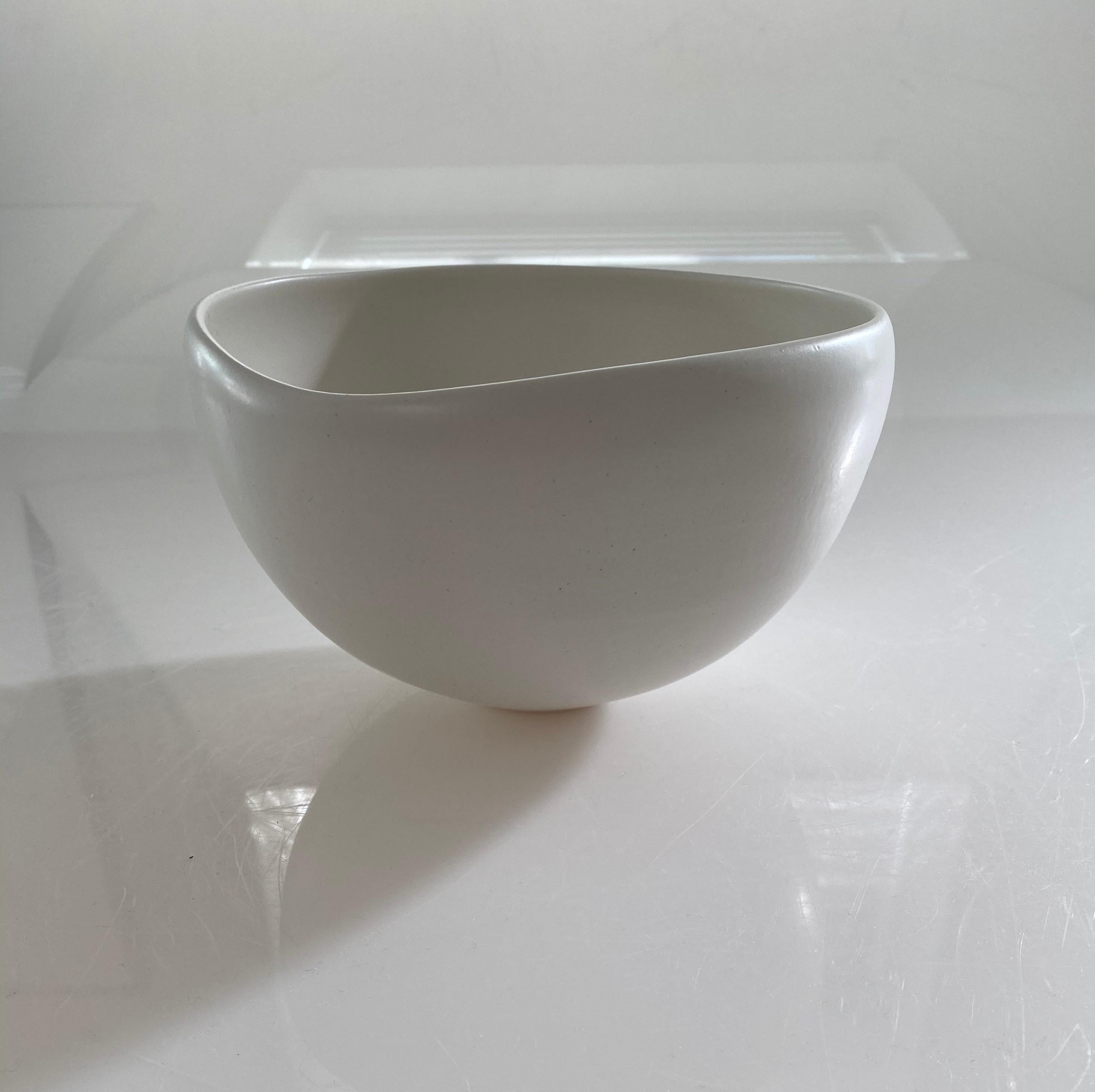 Spouted bowl porcelain vase with alabaster glaze
Can hold water
One of several pieces from a large collection
Veteran photographer Sandi Fellman's ceramic vessels are an exploration of a new medium.The forms, palettes, and sensuality of her