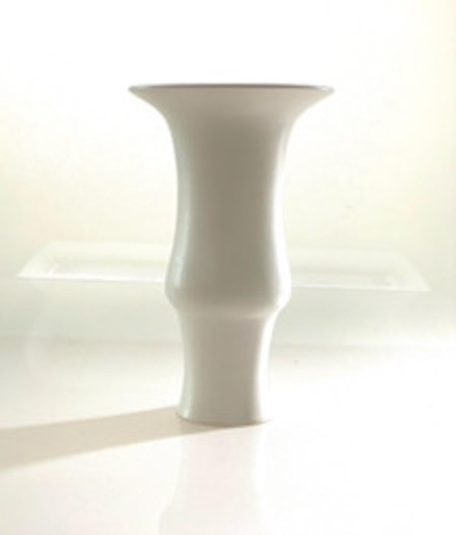 Tall classic shaped porcelain vase with alabaster glaze
Can hold water
One of several pieces from a large collection
Veteran photographer Sandi Fellman's ceramic vessels are an exploration of a new medium. The forms, palettes, and sensuality of