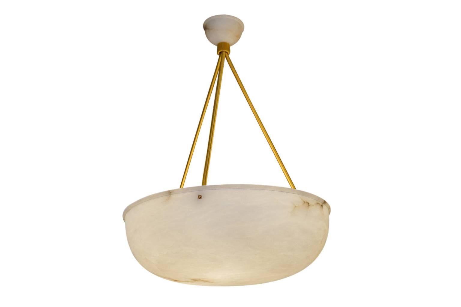 A beloved Swedish design, a simple deep bowl surmounted by a single carved rim, features a perfectly matching alabaster canopy. The light fixture has been recently rewired to an overall drop of 30