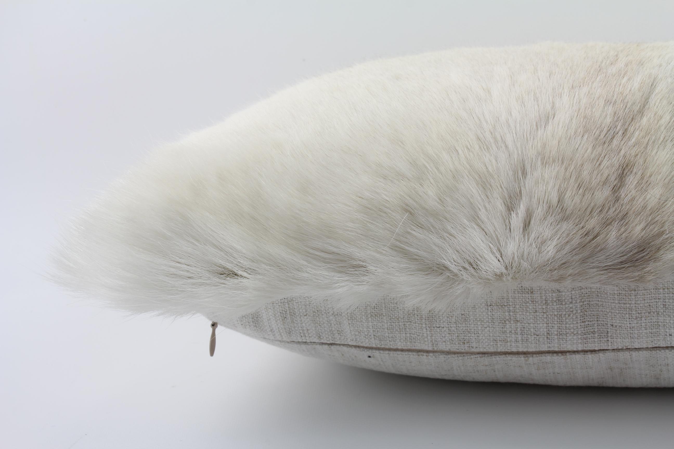 white fur cushion