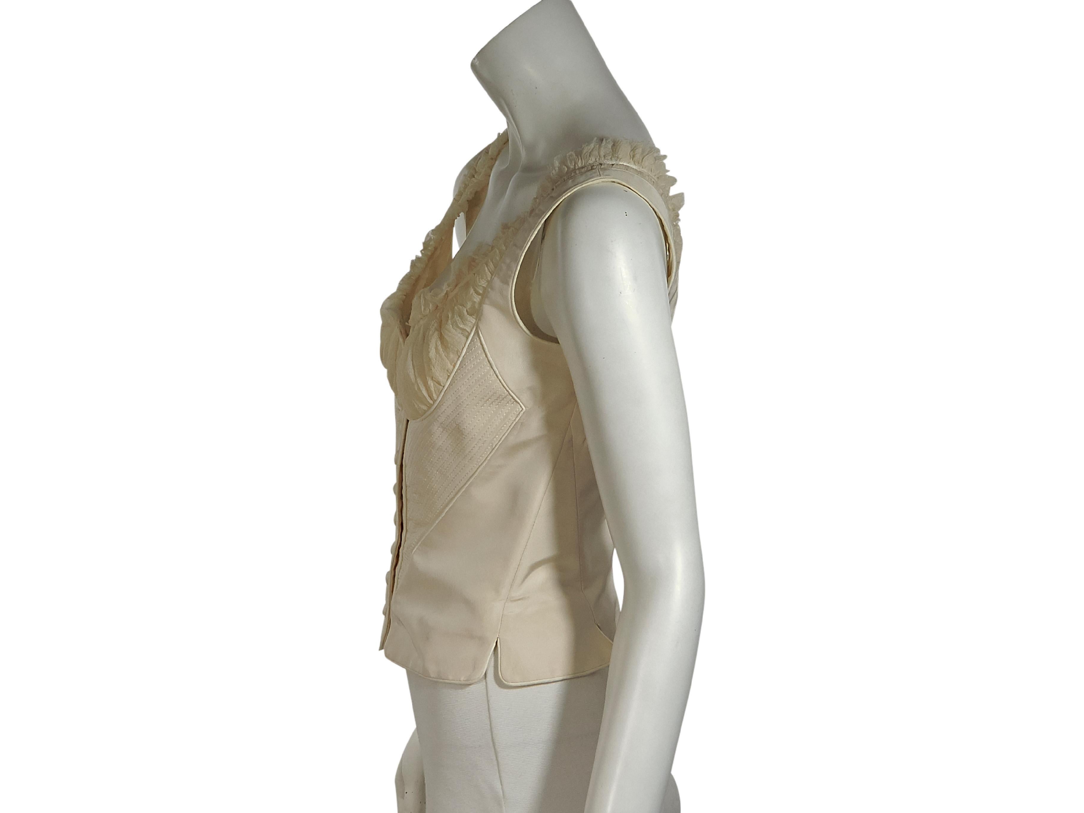 Product details:  White silk corset top by Alexander McQueen.  Scoopneck.  Sleeveless.  Button-front closure.  Lace-up back detail.  32