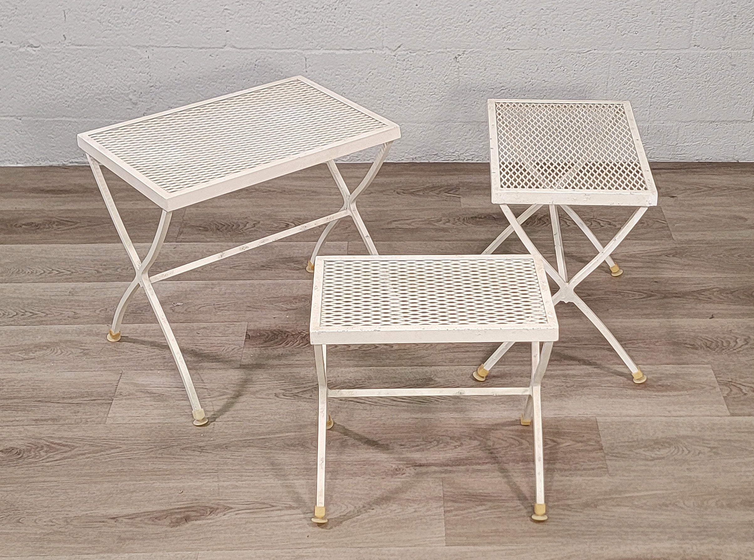 Transform your living space with this chic set of 3 Vintage MCM Aluminum Nesting Tables exuding timeless American style. Crafted with meticulous detail, these tables seamlessly blend functionality with mid-century modern charm, making them a perfect