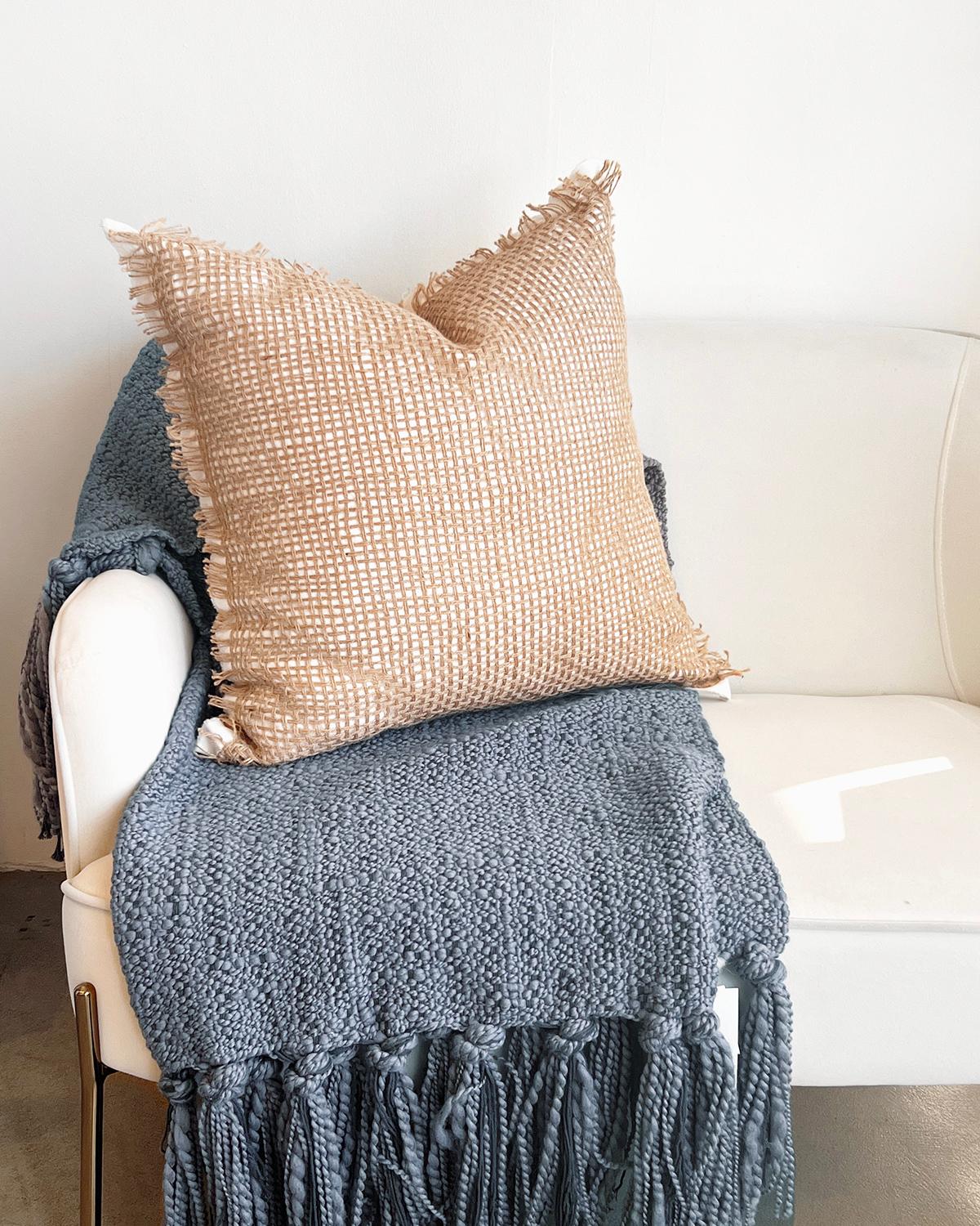 A rustic pillow for your couch. Add a touch of rustic charm to your home decor with our Tramas Linen & Jute Pillow. Featuring a linen and jute open weave, this throw pillow is perfect for any couch, chair, or bed. Perfect for country, boho, or