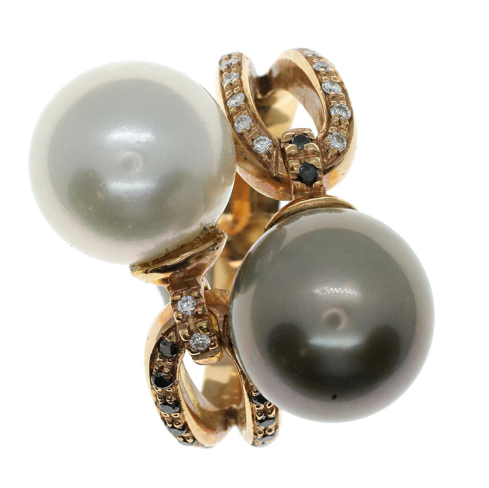 A stunning black and white cocktail ring that is glamorous both on and off the hand. Hand-made, this ring features a large 21.2-carat Australian pearl and a 20-carat Tahitian pearl. The luminous light and dark pearls are set into 18-karat rose gold,