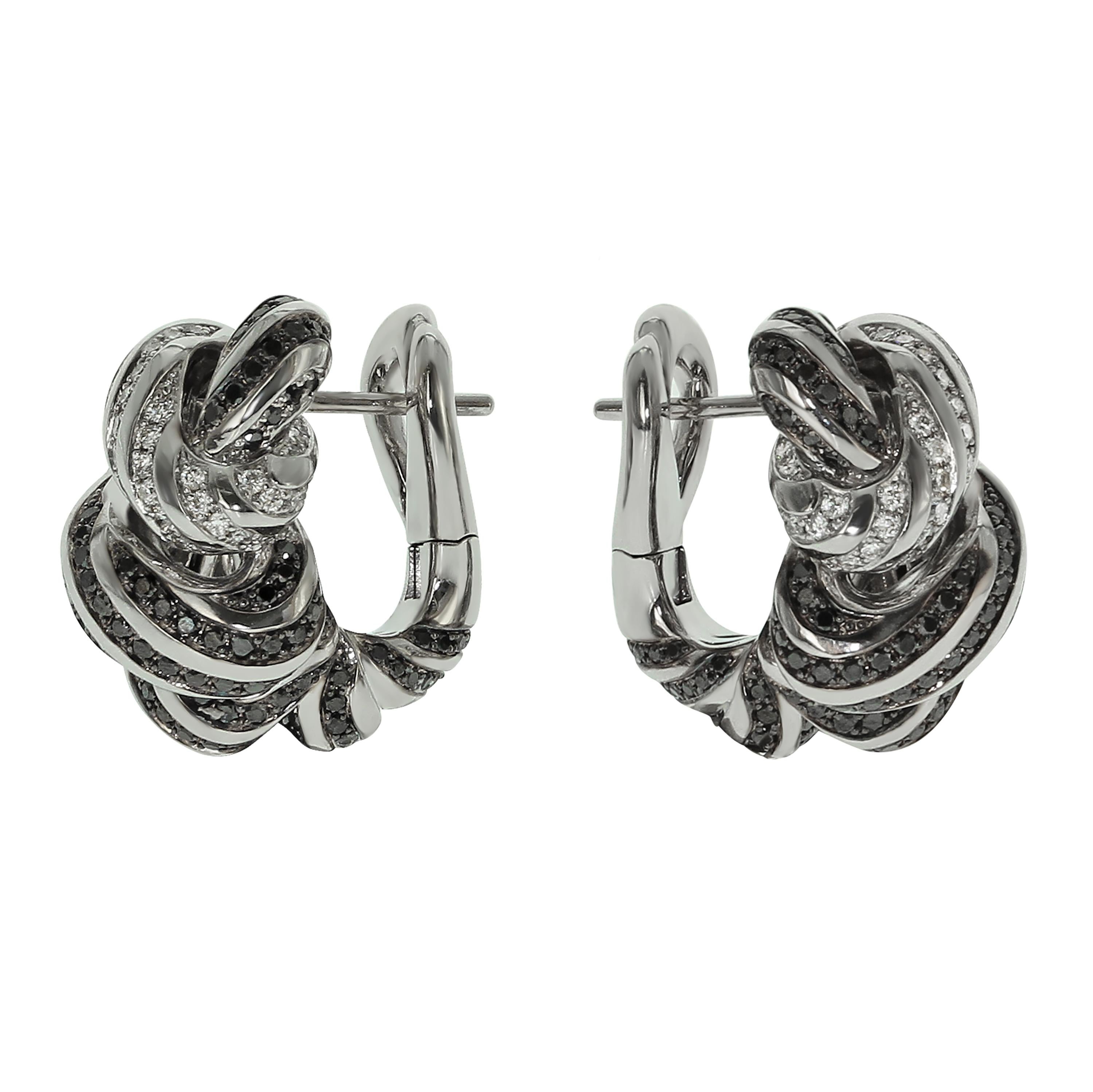 White and Black Diamonds 18 Karat White Gold Earrings
Stunning contrast of 90 White and 302 Black Diamonds totaling 2.39 Carats makes this piece of art always noticeable. Shape of the Ring looks like the interweaving of different shreds of