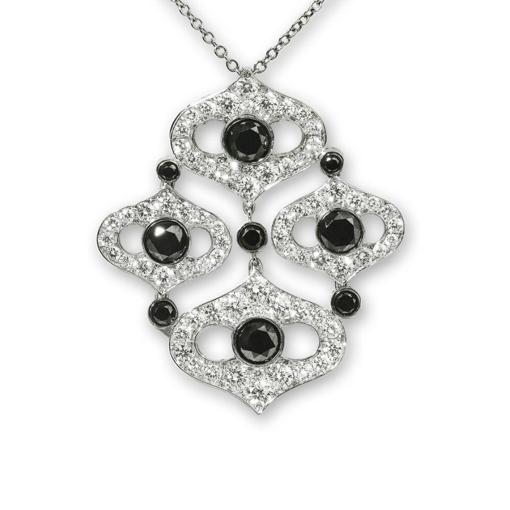 Inspired by Indian art, this black and white diamond necklace adds an exotic touch to both your everyday outfits and elegant cocktail dresses. White diamonds cluster in four shapes that form a geometric design adorned with intervals of bezel-set