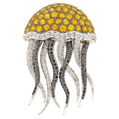 Broche medusa de oro blanco y ennegrecido, diamante y zafiro