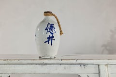 White and Blue Ceramic Jug with Calligraphy and Braided Rope Handle