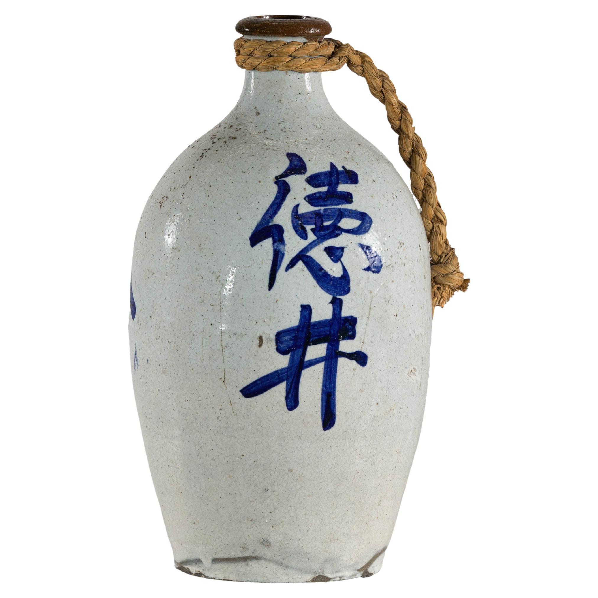 White and Blue Ceramic Jug with Calligraphy and Braided Rope Handle