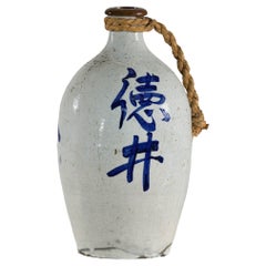 Vintage White and Blue Ceramic Jug with Calligraphy and Braided Rope Handle