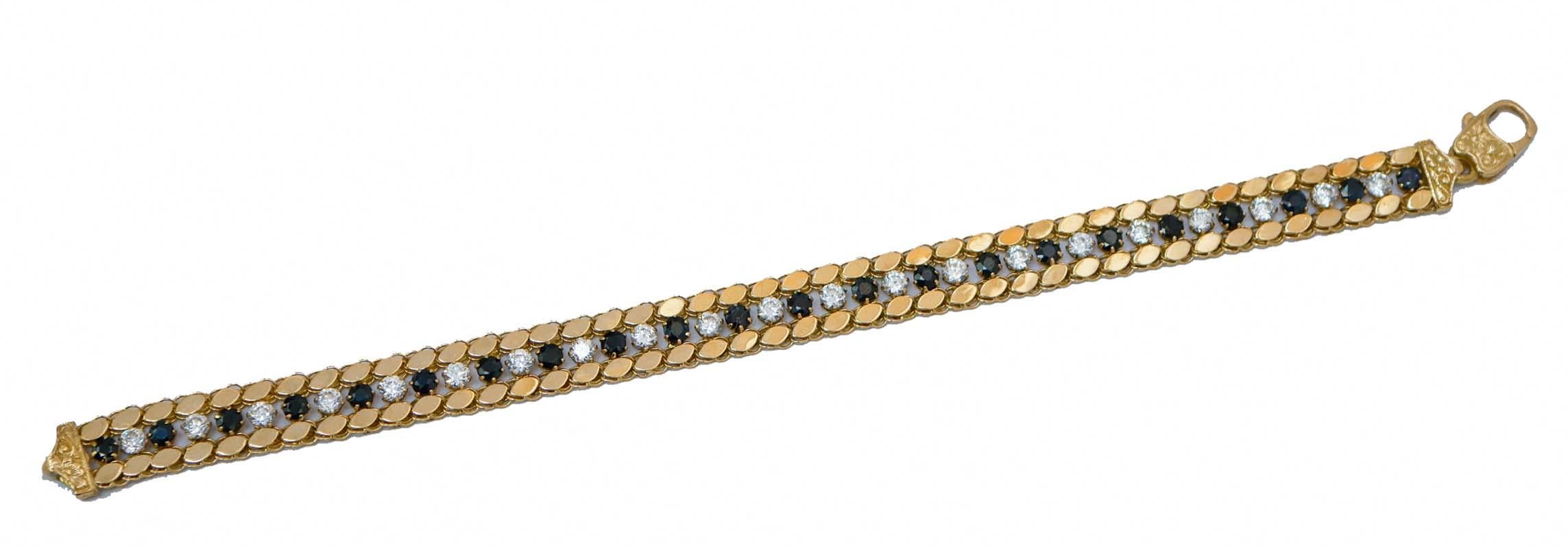 Elegant bracelet in 18 kt yellow gold structure mounted with blue and white stones.
This bracelet was totally handmade by Italian master goldsmiths and it is in perfect conditions.
Stones 2.10 gr
Total Weight 14.80 gr
RF  +FIEU
RK.AOHE

For any
