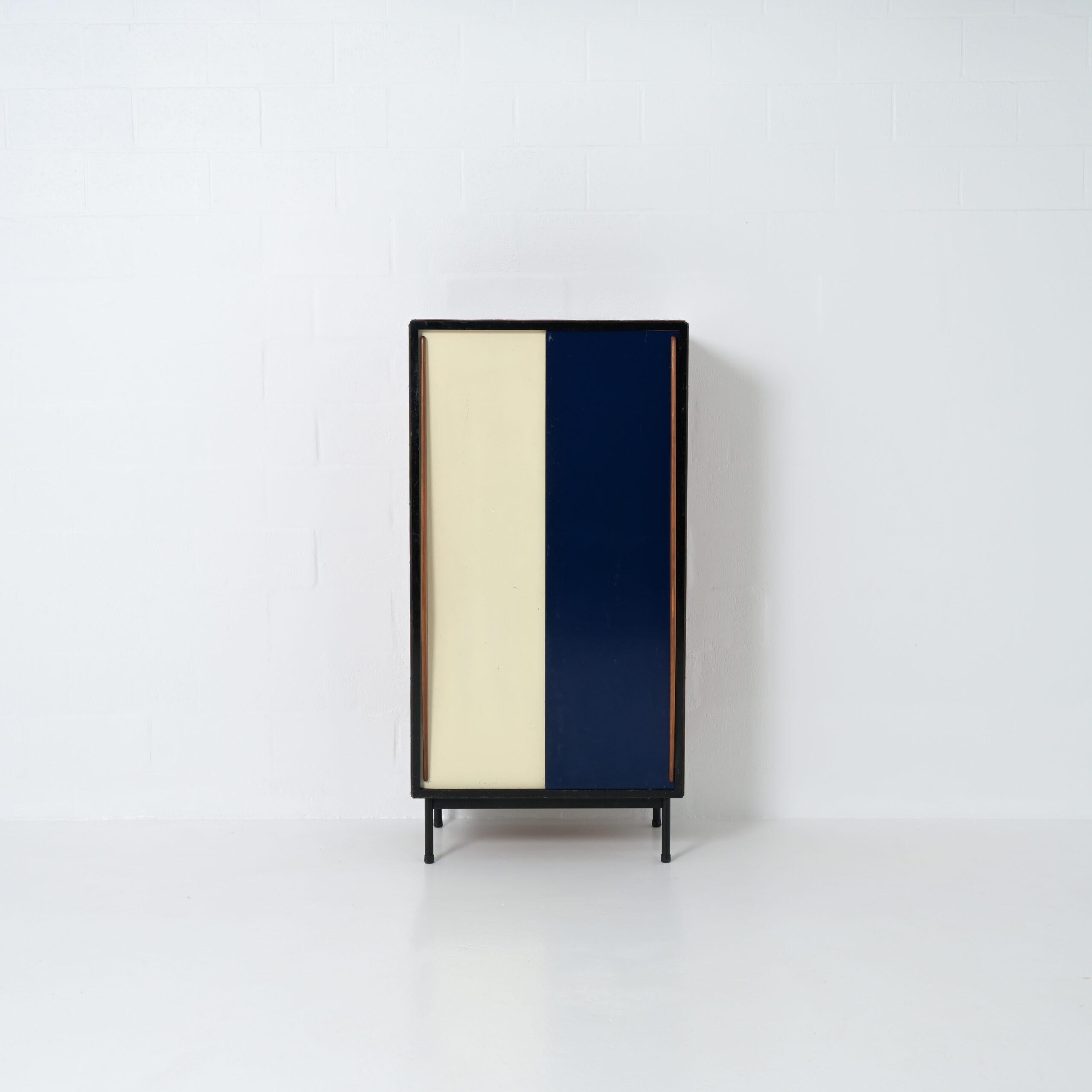 This small wardrobe cabinet was designed by the Belgian designer Willy Van Der Meeren for Tubax in the early 1950s.
It is a classic example of mid-century Belgian social furniture design: those cabinets were used in schools and factories.

This