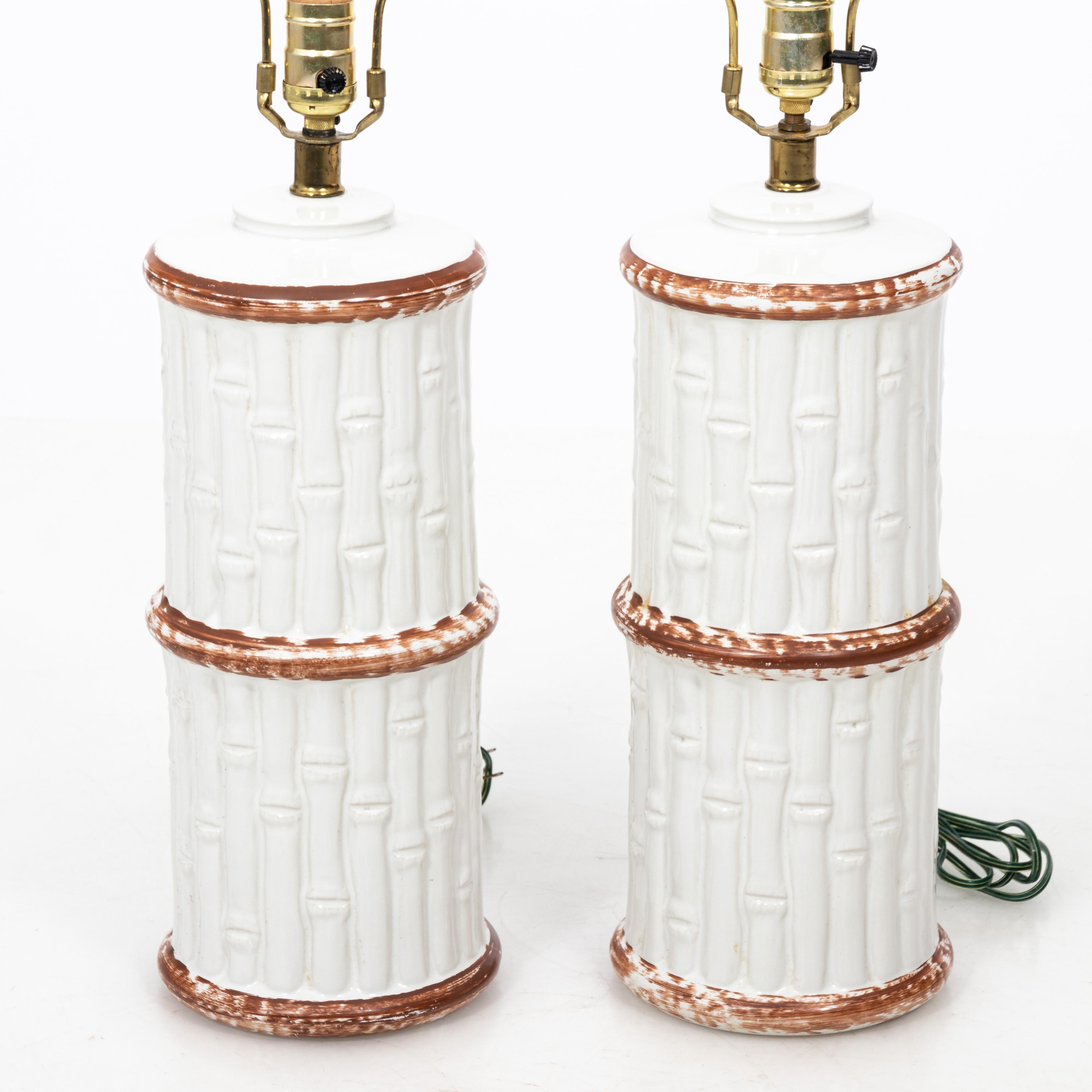 Pair of painted ceramic faux bamboo table lamps with harps, circa 1970s.