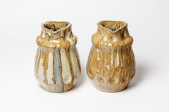 Paire de vases en céramique émaillée blanche et brune de Jean Langlade, vers 1920.